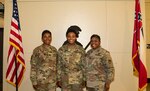 From left to right: Lt. Col. Annie Lee, G4 for the 184th Sustainment Command, Sgt. Nia Davis, a human resources noncommissioned officer with the Higher Headquarters Command 66th Troop Command, and Brigade Command Sgt. Maj. for the 407th Army Field Support Brigade Stephanie Price. Davis’ family members Lee (mother) and Price (aunt) were in attendance for her promotion ceremony from specialist to sergeant.