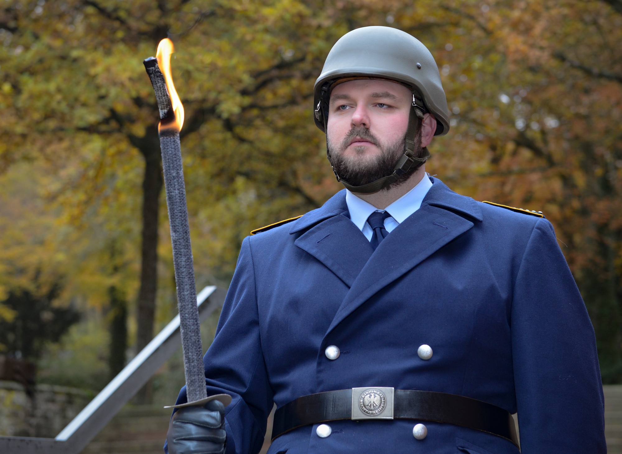 A German military member holds a ceremonial flaming sword during the City of Kaiserslautern’s National Day of Mourning Ceremony, Kaiserslautern, Germany, Nov. 17, 2019. The National Day of Mourning (Volkstrauertag) is an annual German occasion to remember all victims of war and tyranny. It was established in 1922 and was initially dedicated to the victims of World War I. As with the Sunday of the Dead (Totensonntag), the National Day of Mourning is a “silent day,” which means that in some regions of Germany music and dance events are prohibited.