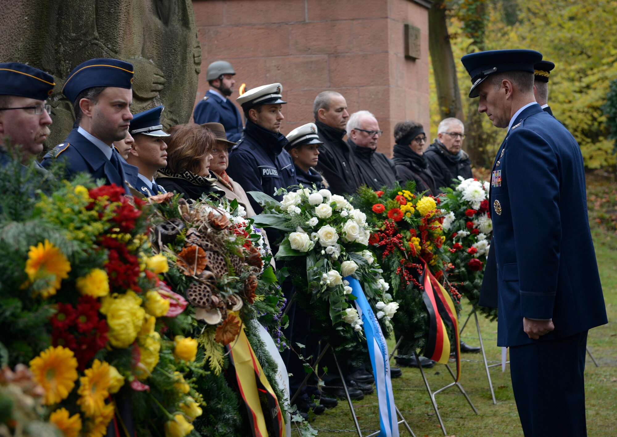 U.S. Air Force Col. Matthew Husemann, 86th Airlift Wing Vice Commander, stands in respect before ceremonial wreaths during the City of Kaiserslautern’s National Day of Mourning Ceremony, Kaiserslautern, Germany, Nov. 17, 2019. Kaiserslautern’s Lord Mayor Dr. Klaus Weichel and the German War Graves Commission invited Ramstein Air Base leadership to attend the ceremony. Known in Germany as Volkstrauertag, the National Day of Mounring is a time to remember the tragedy of war and mourn the victims, and to speak out for peace.
