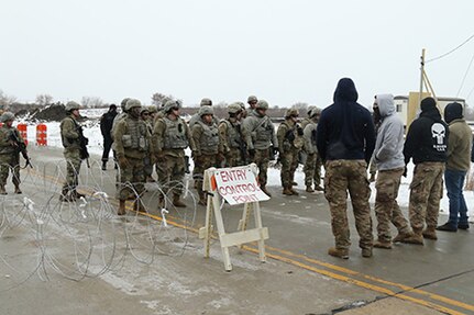 Fictional protesters confront Soldiers from the Wisconsin Army National Guard’s 32nd Military Police Company at an entry control point at a power substation in Racine County Nov. 13, 2019, as part of GridEx, an exercise that tested Wisconsin’s capacity to respond to a long-term mass power outage.