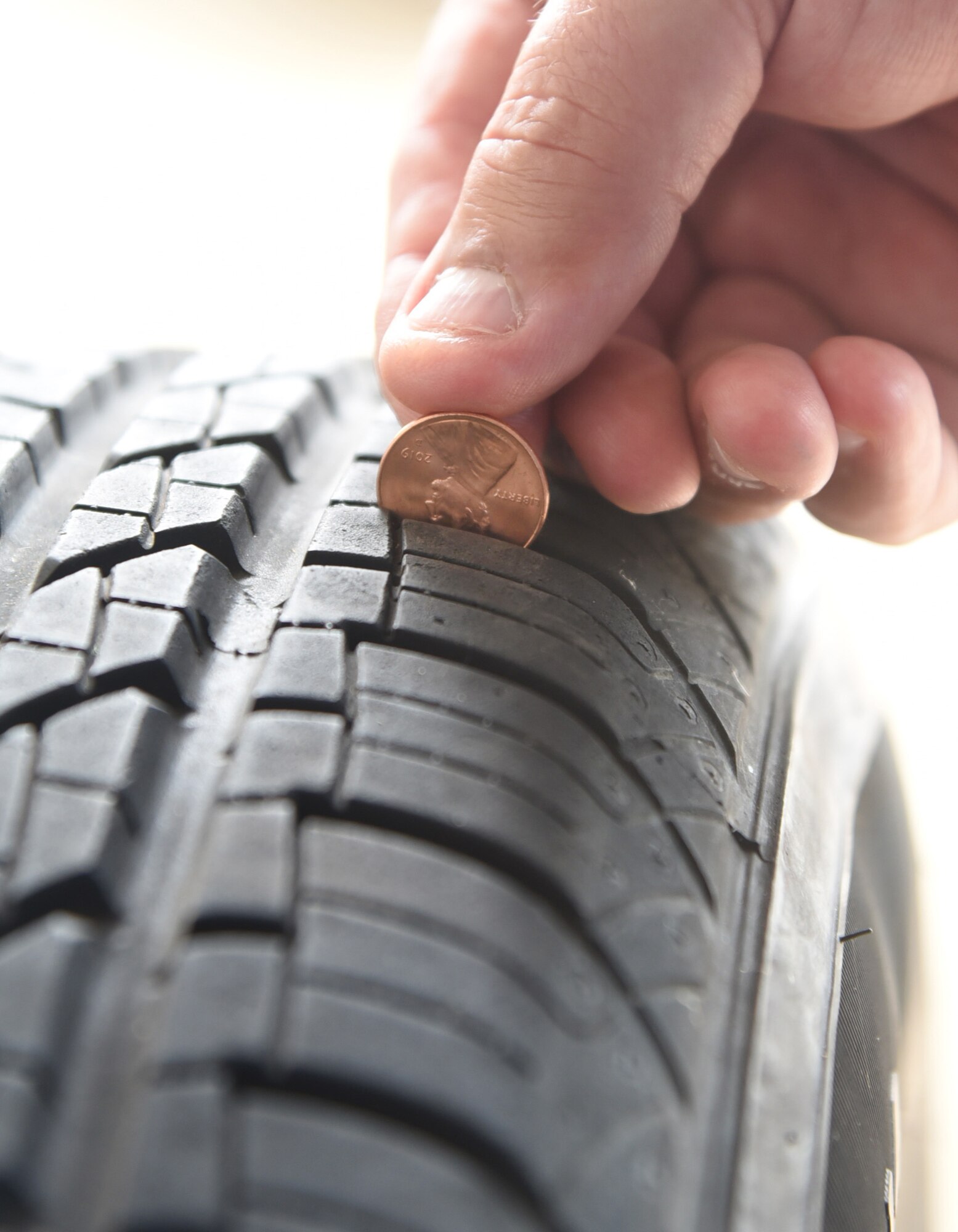 An image depicting the "penny test" to check the tread of your tires.