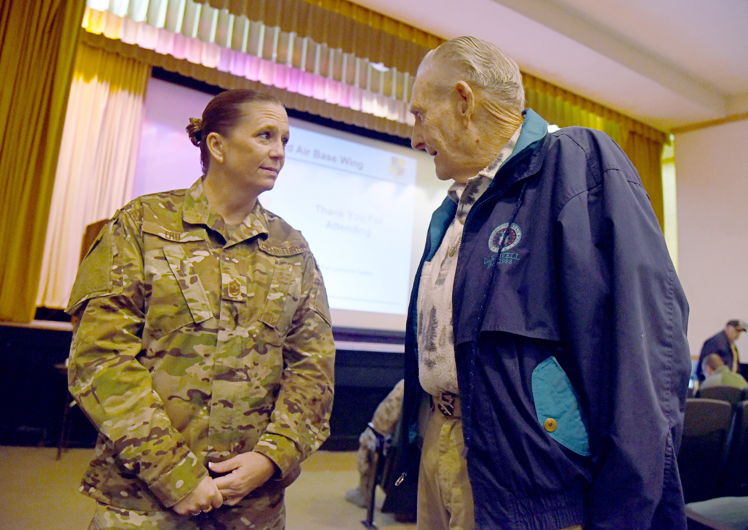 An image of the 72nd Air Base Wing Command Chief talking to a retiree during Tinker's Retiree Appreciation Day