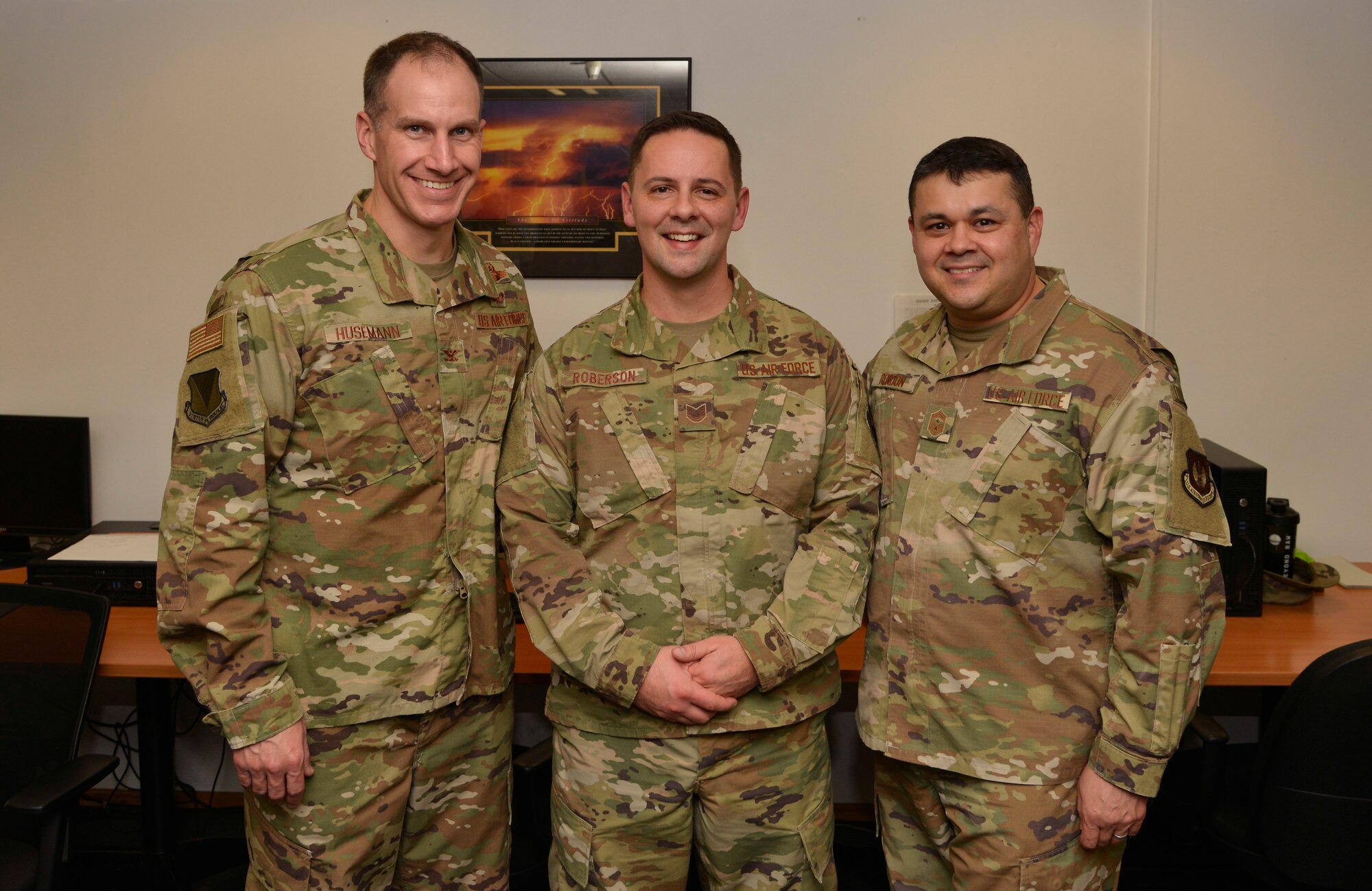 U.S. Air Force Col. Matthew S. Husemann, 86th Airlift Wing vice commander, and Chief Master Sgt. Ernesto J. Rendon, 86th AW command chief, pose with Tech. Sgt. Kendal “Wade” Roberson, 86th Maintenance Squadron hydraulic section chief, after recognizing Roberson as Airlifter of the Week at Ramstein Air Base, Germany, Nov. 5, 2019.