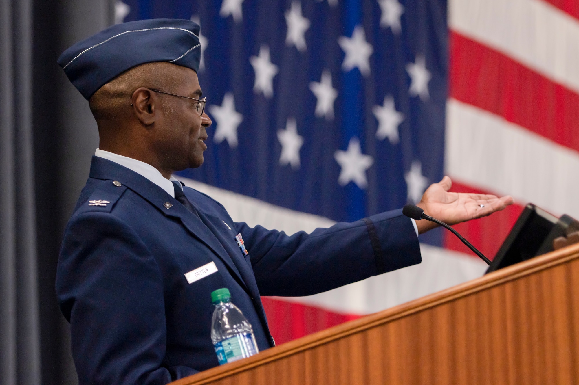 Photo of Col. Dennis Britten speaking at during his change of command ceremony.
