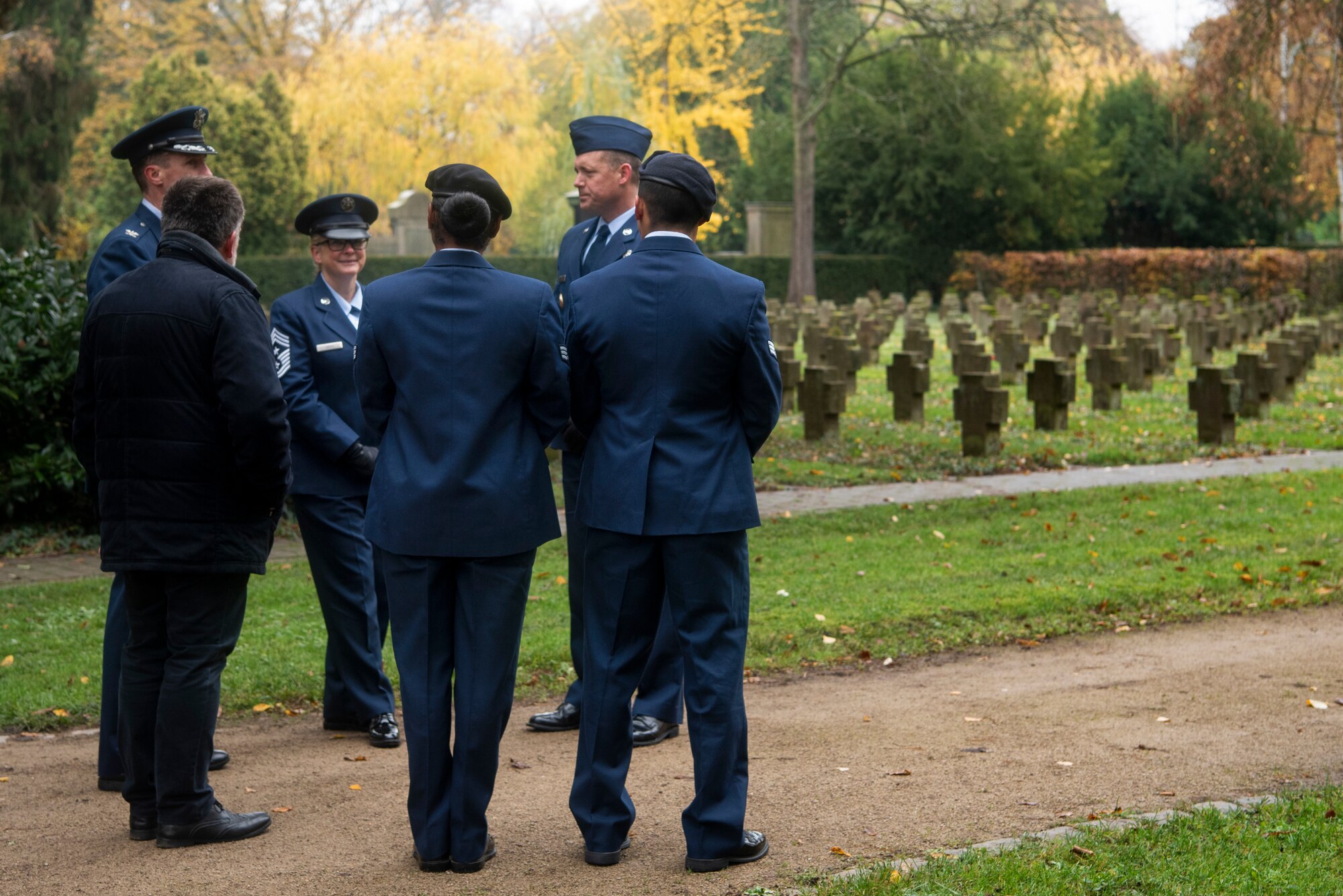 U.S. Air Force Col. David Epperson, 52nd Fighter Wing commander, back left, Chief Master Sgt. Stephanie Cates, 52nd FW command chief, back center left, and members of the 52nd FW, reflect on the German National Day of Mourning after participating in a commemoration ceremony at the Trier cemetery in Trier, Germany, Nov. 17, 2019. Members of the 52nd Security Forces Squadron laid a wreath to honor all those who have lost their lives to war. In some parts of the country, the annual holiday is a silent day, meaning music and dancing are prohibited. (U.S. Air Force photo by Airman 1st Class Valerie Seelye)