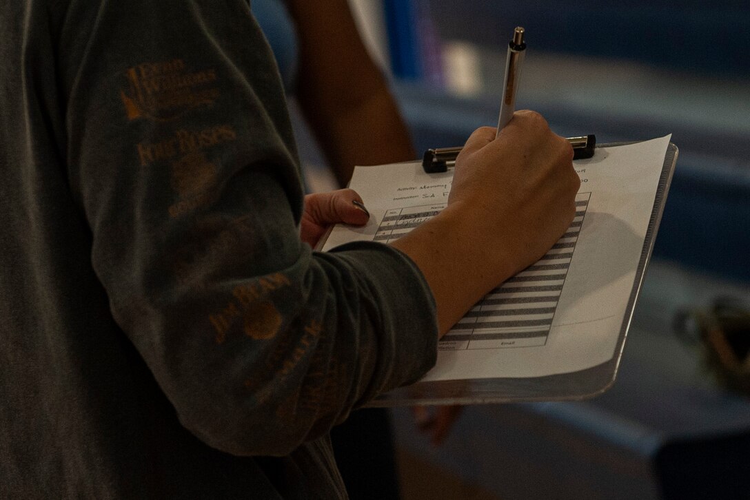 A photo of a participant signing in to Family Boot Camp