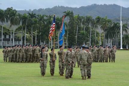 The 205th Military Intelligence Battalion, prepares to execute the passing of the Battalion colors from Lt. Col. Wayne E. Prince, outgoing commander, to Lt. Col. Scott H. Starr, incoming commander, during a change of command ceremony at historic Palm Circle on Fort Shafter, Hawaii, June 27. Through the new Army Talent Alignment Process, the Battalion Commander Assessment Program, or BCAP, will change the way officers are selected for command positions moving forward.