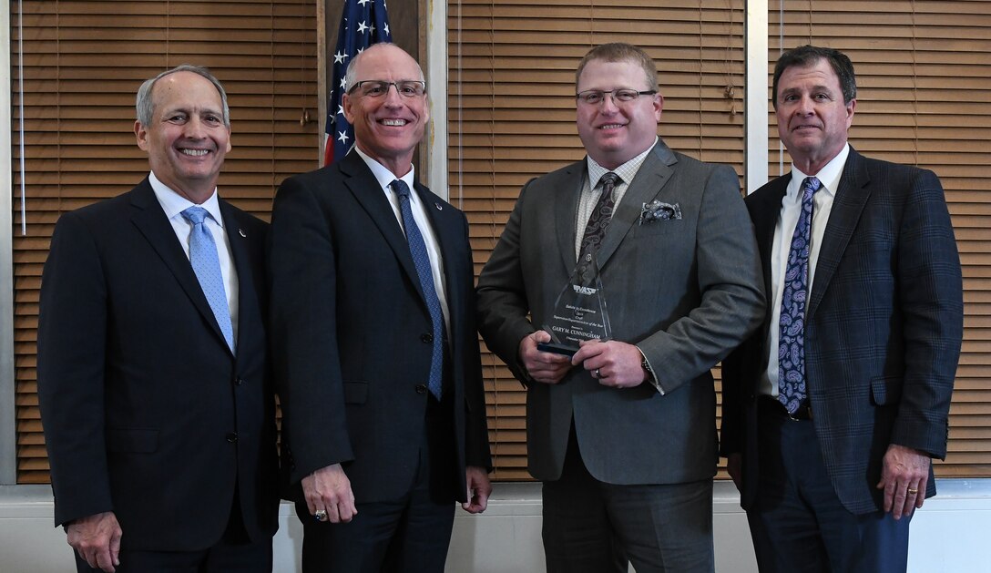 Craft Superintendent/Craft Supervisor Gary Cunningham, third from left, receives the Crafts Supervisor/Superintendent of the Year award during the National Aerospace Solutions (NAS), LLC, Salute to Excellence Annual Awards Banquet, Nov. 5, 2019, at the Arnold Lakeside Center, Arnold Air Force Base, Tenn. Also pictured, from left, is NAS Deputy General Manager Michael Belzil, NAS General Manager Dr. Richard Tighe and NAS Performance Integrated Resources Director Kevin Chalmers. (U.S. Air Force photo by Jill Pickett)