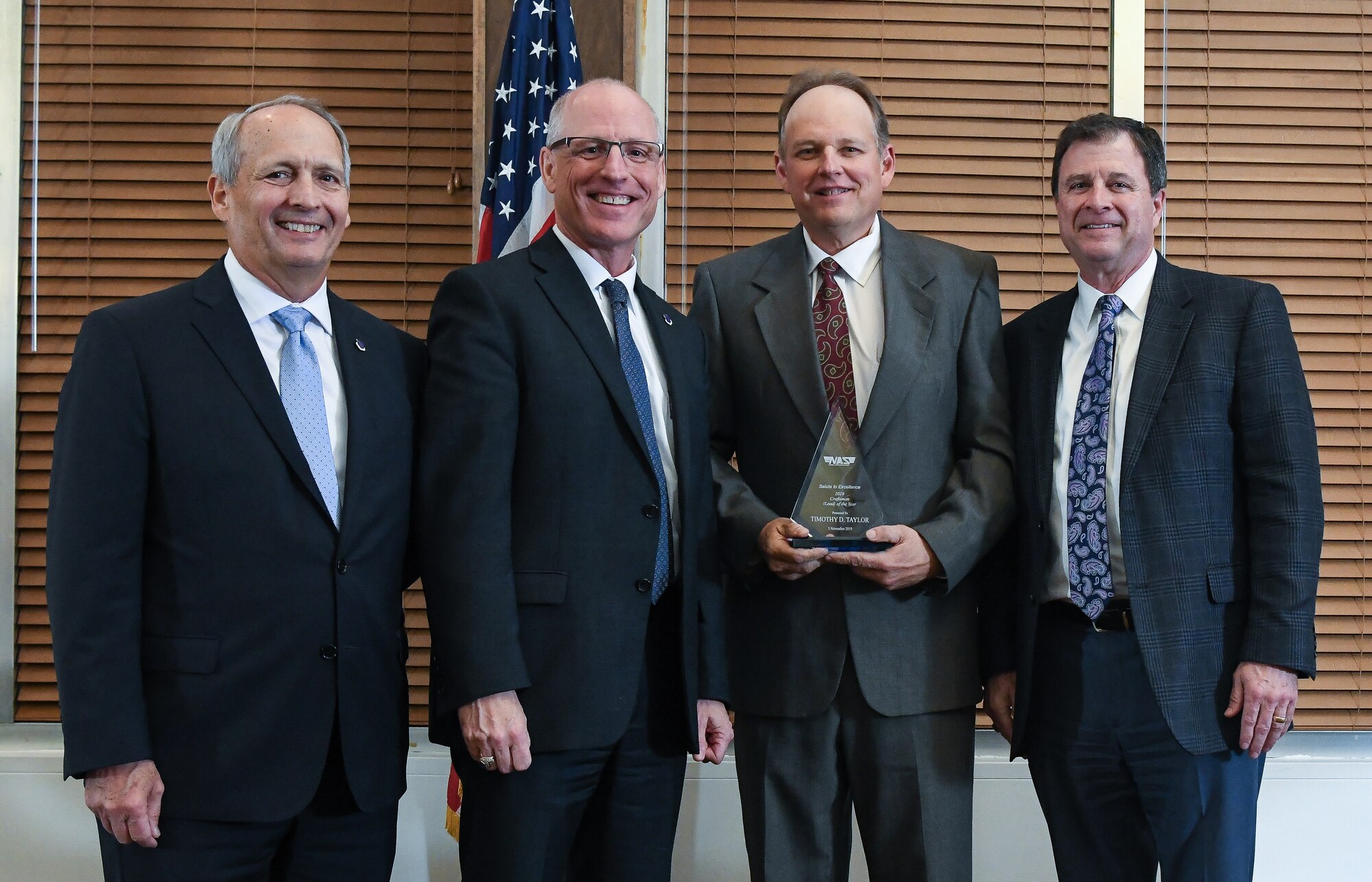 Boilermaker Lead Timothy Taylor, third from left, receives the Craftsman Lead of the Year during the National Aerospace Solutions (NAS), LLC, Salute to Excellence Annual Awards Banquet, Nov. 5, 2019, at the Arnold Lakeside Center, Arnold Air Force Base, Tenn. Also pictured, from left, is NAS Deputy General Manager Michael Belzil, NAS General Manager Dr. Richard Tighe and NAS Integrated Resources Director Kevin Chalmers. (U.S. Air Force photo by Jill Pickett)