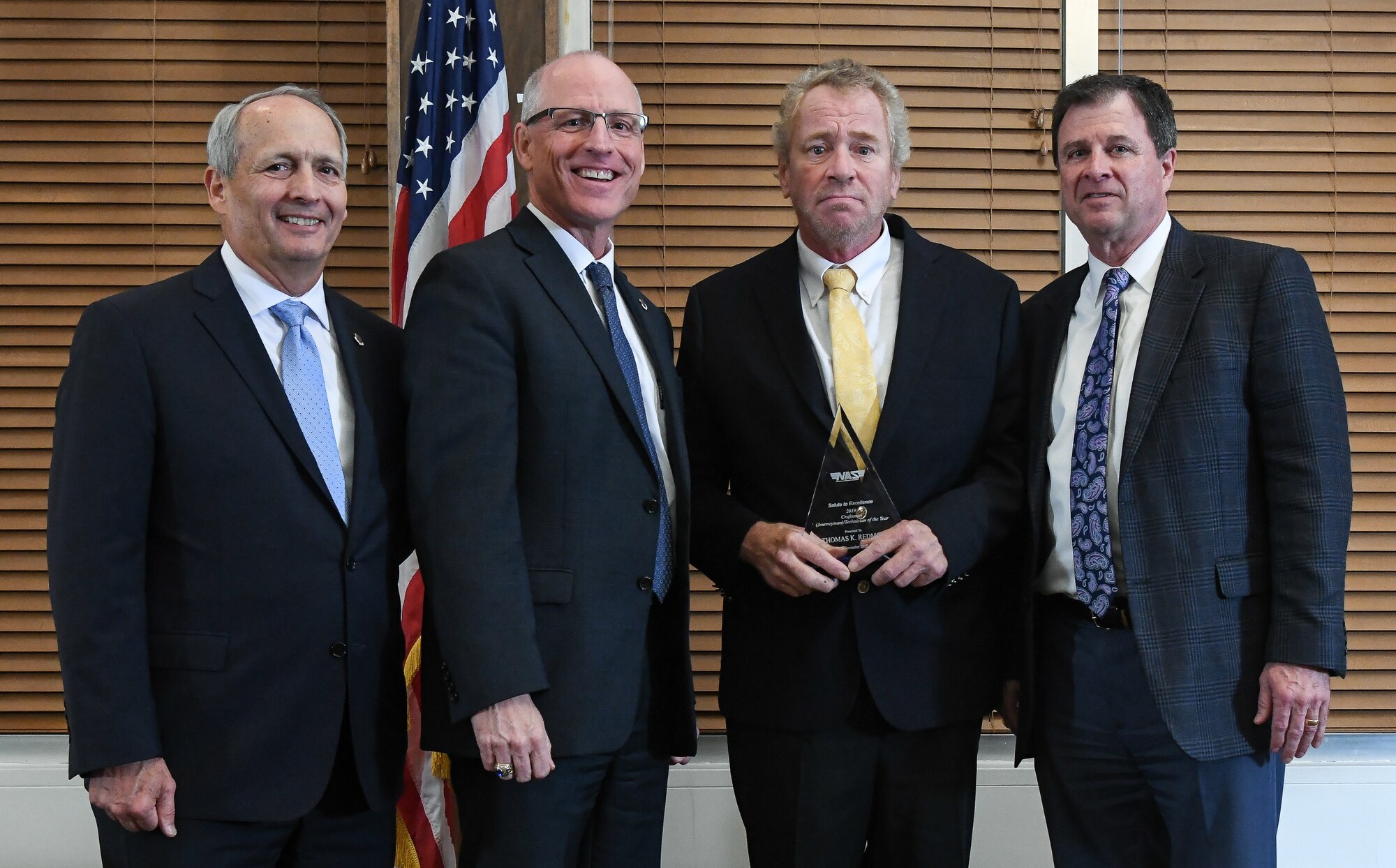 Electrician Journeyman Thomas Redmon receives the Craftsman Journeyman/Technician of the Year award during the National Aerospace Solutions (NAS), LLC, Salute to Excellence Annual Awards Banquet, Nov. 5, 2019, at the Arnold Lakeside Center, Arnold Air Force Base, Tenn. Also pictured, from left, is NAS Deputy General Manager Michael Belzil, NAS General Manager Dr. Richard Tighe and NAS Performance Integrated Resources Director Kevin Chalmers. (U.S. Air Force photo by Jill Pickett)