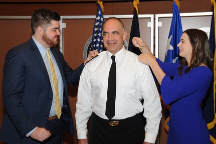 U.S. Navy Adm. Charles "Chas" A. Richard (center), incoming commander of U.S. Strategic Command (USSTRATCOM), receives his new rank insignia from his family during a ceremony at Offutt Air Force Base, Neb., Nov. 18, 2019. Richard previously served as the commander of Submarine Forces; commander of Submarine Force Atlantic and commander of Allied Submarine Command at Naval Station Norfolk, Va. USSTRATCOM is a global warfighting command and the ultimate guarantor of national and allied security with forces and capability that underpin and enable all other joint force operations.