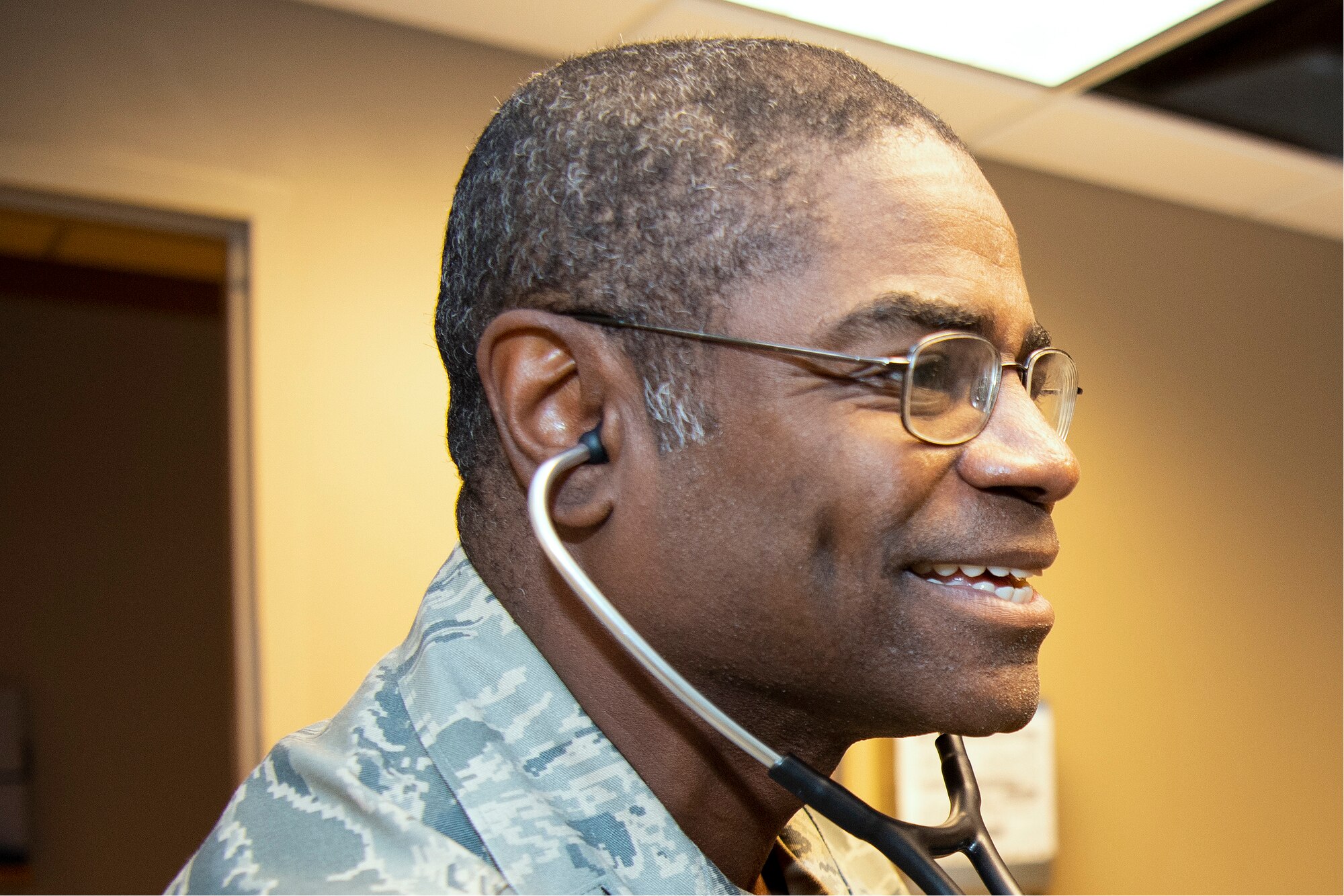 Photo of Col. Dennis Britten smiling.