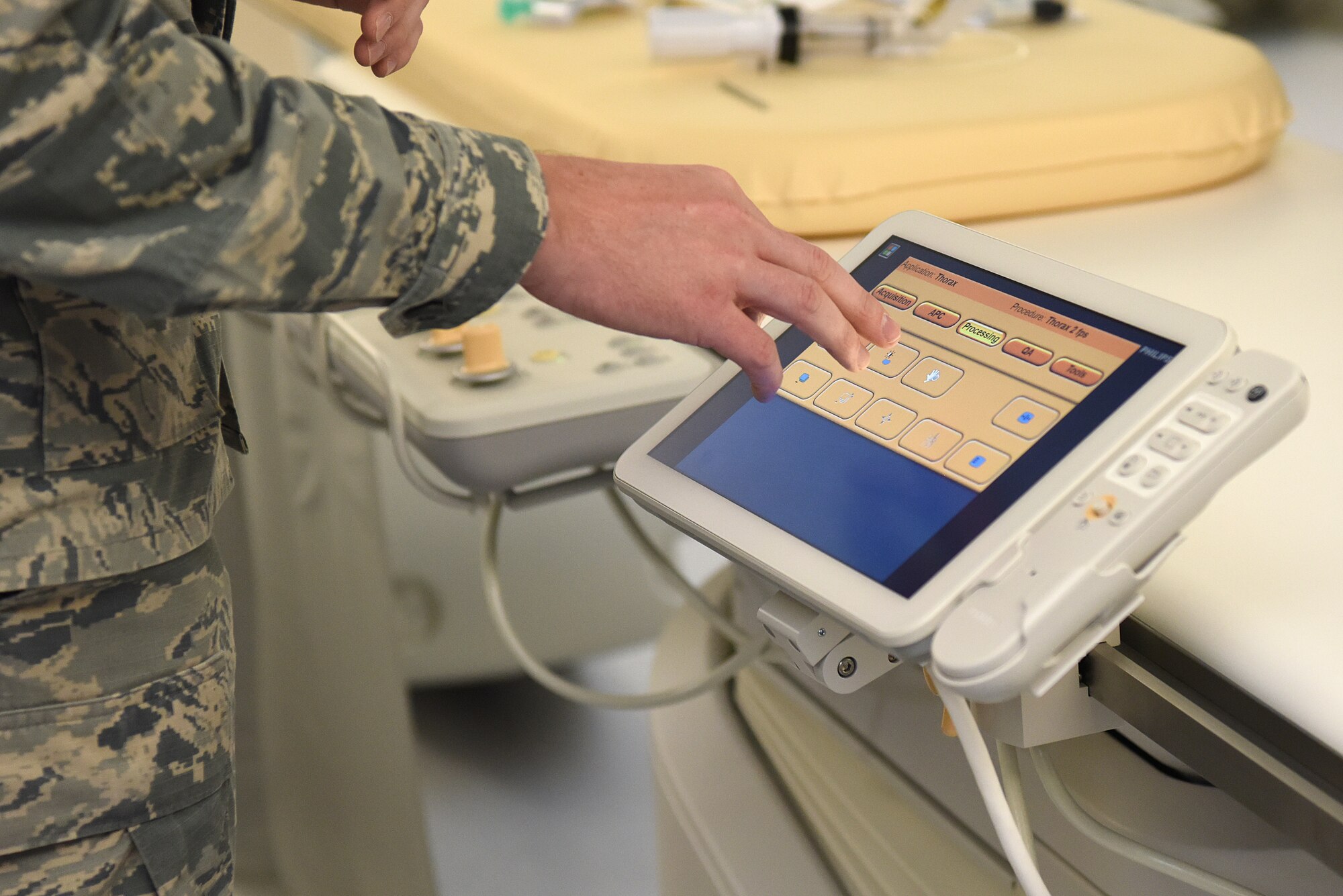 U.S. Air Force Staff Sgt. Matthew Slaven, 81st Medical Operations Squadron cardiopulmonary technician, demonstrates the capabilities of new medical equipment during the cardiac catheterization laboratory ribbon cutting ceremony inside Keesler Medical Center at Keesler Air Force Base, Mississippi, Nov. 15, 2019. The lab was upgraded with an entire suite of technology to provide better and safer care for patients and the surgical team. (U.S. Air Force photo by Senior Airman Suzie Plotnikov)