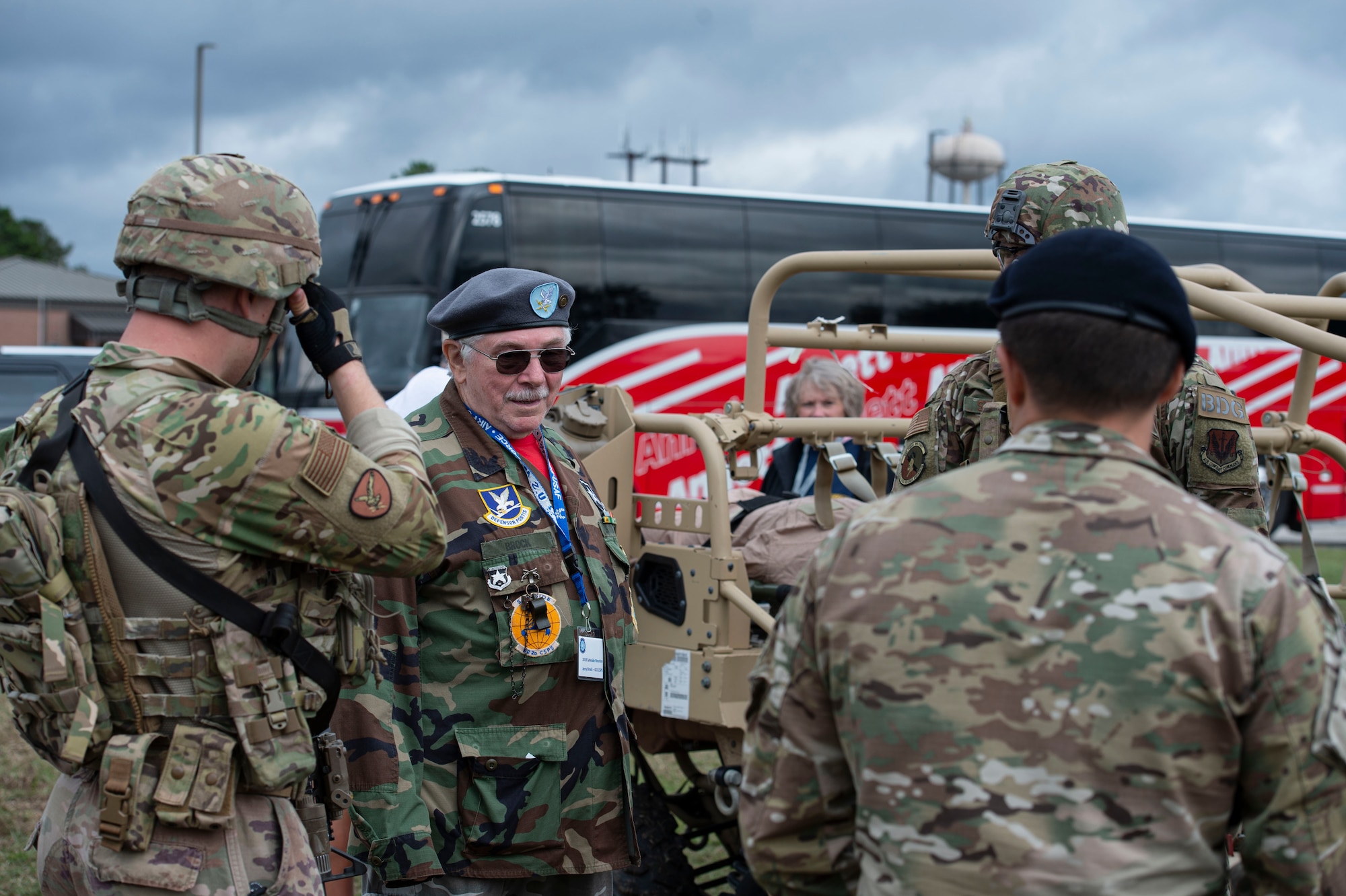 A photo of Airmen speaking with a member of the Safeside Association.