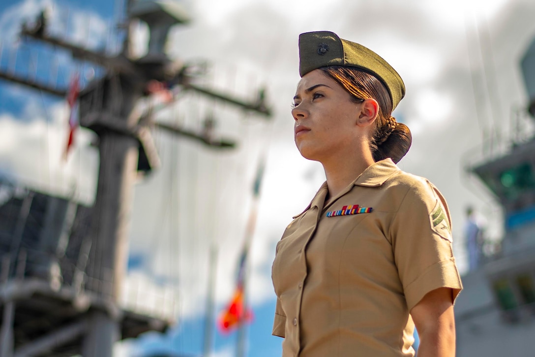 A Marine stands on a ship.