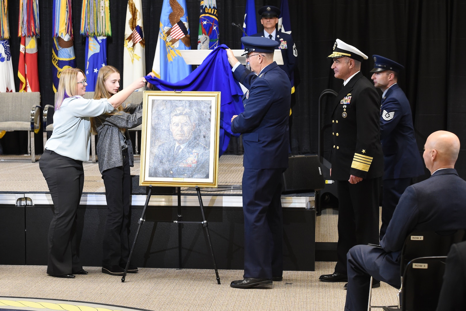U.S. Air Force Gen. John E. Hyten, commander of U.S. Strategic Command (USSTRATCOM), unveils a portrait of U.S. Air Force Gen. Curtis E. LeMay during a building dedication ceremony held at Offutt Air Force Base, Neb, Nov. 18, 2019. USSTRATCOM dedicated its new command and control facility to LeMay, which is the heart of the Department of Defense's nuclear command, control, and communications enterprise. (U.S. Air Force photo by Staff Sgt. Ian Hoachlander)
