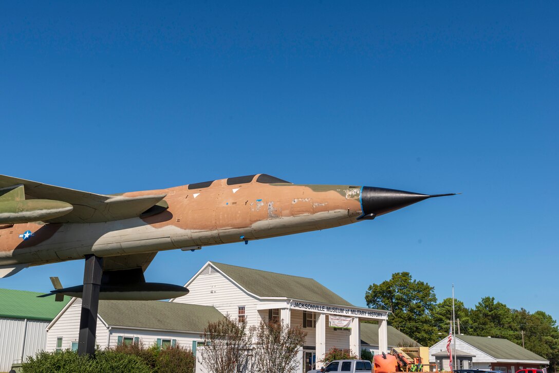 Airmen from the 19th Maintenance Squadron, 19th Airlift Wing, Little Rock Air Force Base, Ark. clean and prepare a F-105 Thunderchief static display aircraft outside of the Military Museum, Oct. 8, 2019, at Jacksonville, Ark. Staff Sgts. Scott Tipton and Randy Bloom, Airmen First Class Jacob Russell, Tyler Nguyen, and Luise Lopez use paint donated by local businesses to repair the aircraft throughout the month. Chief Master Sgt. Ralph Babcock, 913th Maintenance Squadron superintendent coordinated the renovation effort prior to his deployment.