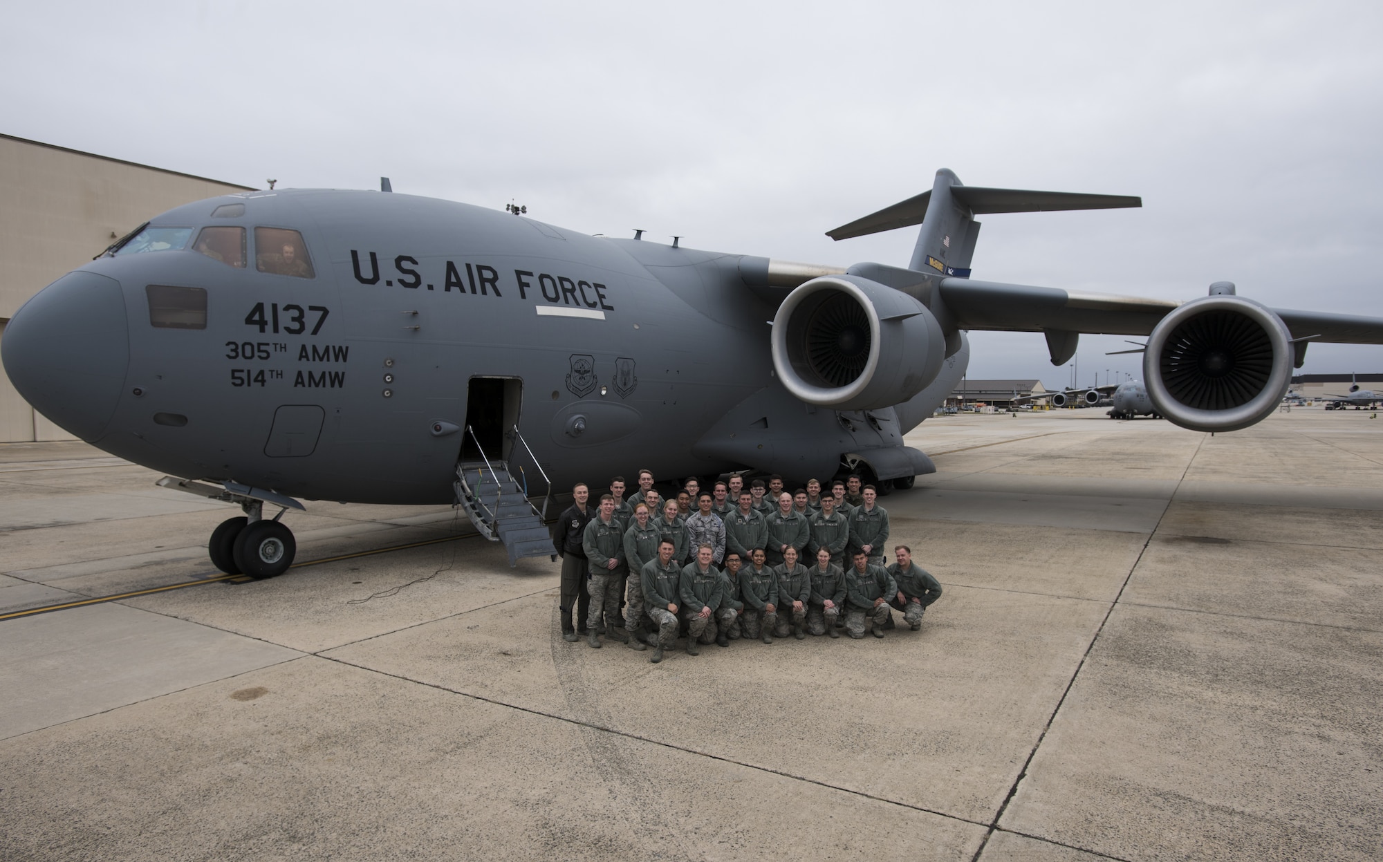 U.S. Air Force Academy Cadets with the 23rd Cadet Squadron pose for a photo in front of a C-17 Globemaster III during a tour of the 305th Air Mobility Wing on Joint Base McGuire-Dix-Lakehurst, New Jersey, Nov. 17, 2019. The 305th AMW is the 23rd CS sponsor for 2019 which allows the cadets to visit their sponsoring wing and learn about different career paths available for their future as officers. The Academy allots a day and a half for cadets to be excused from school for educational sponsor trips. (U.S. Air Force photo by Airman 1st Class Ariel Owings)