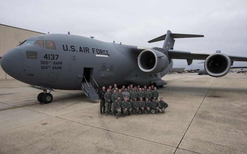 U.S. Air Force Academy Cadets with the 23rd Cadet Squadron pose for a photo in front of a C-17 Globemaster III during a tour of the 305th Air Mobility Wing on Joint Base McGuire-Dix-Lakehurst, New Jersey, Nov. 17, 2019. The 305th AMW is the 23rd CS sponsor for 2019 which allows the cadets to visit their sponsoring wing and learn about different career paths available for their future as officers. The Academy allots a day and a half for cadets to be excused from school for educational sponsor trips. (U.S. Air Force photo by Airman 1st Class Ariel Owings)