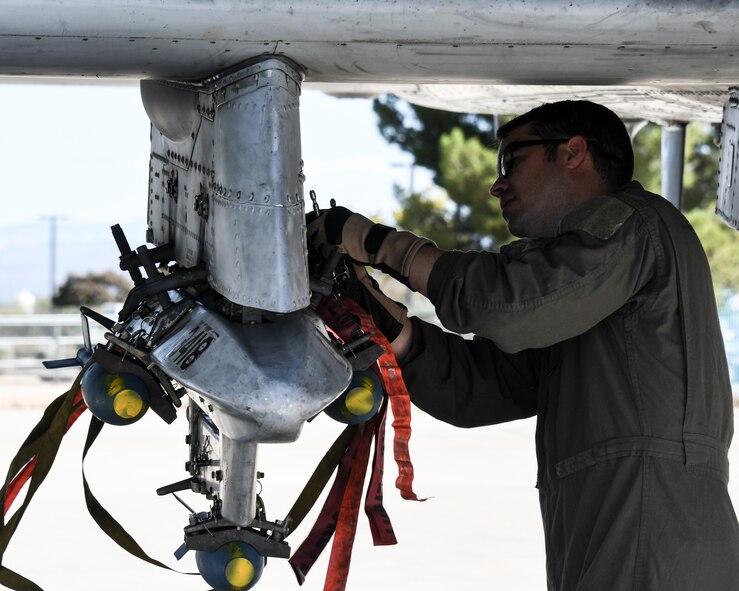 An airman works on an aircraft.