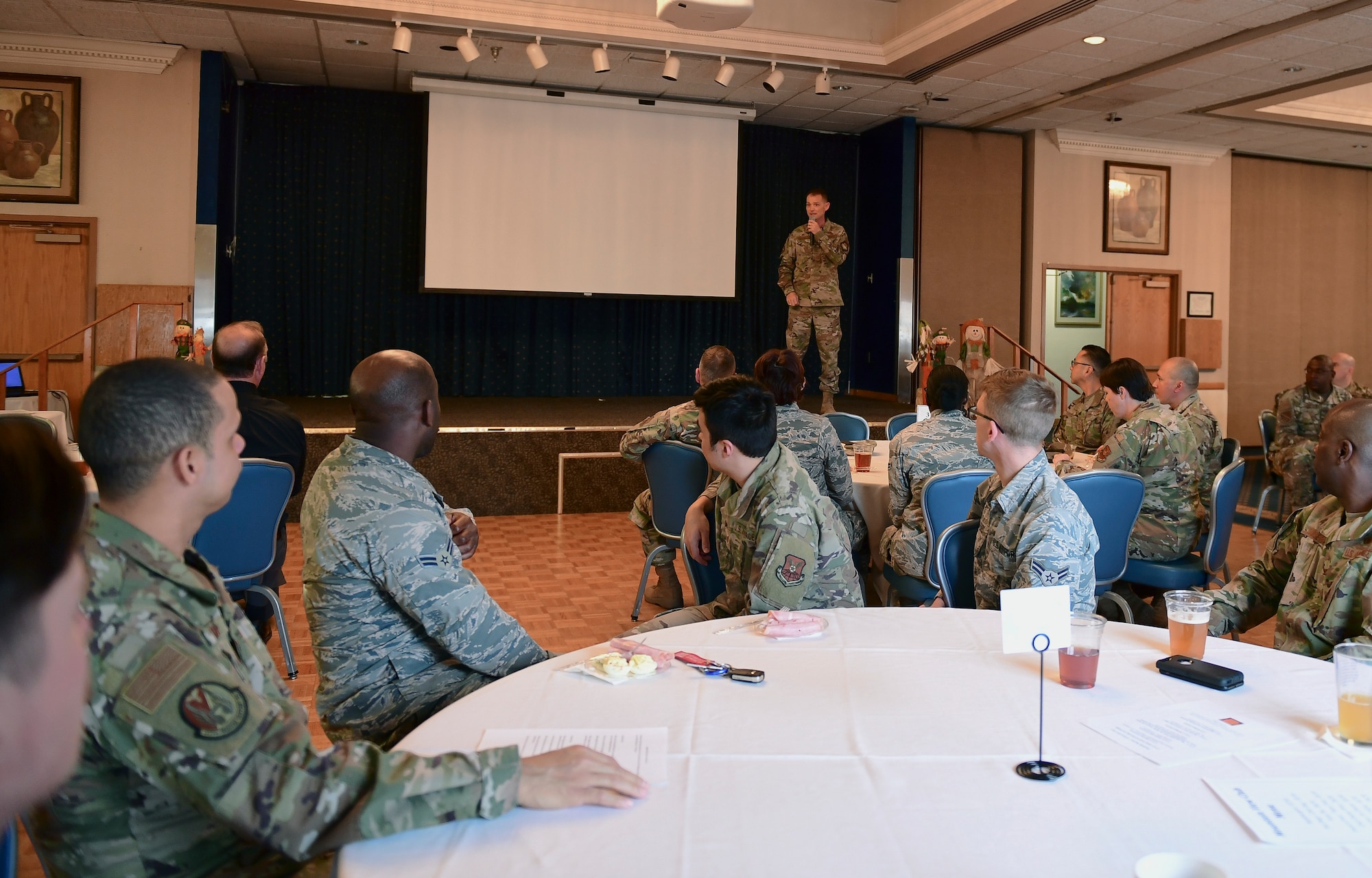 Members of the crowd listen as U.S. Air Force Col. David S. Miller, 377 Air Base Wing commander, speaks during a Storytellers event at Kirtland Air Force Base, N.M., Nov. 15, 2019. During the event two speakers from Team Kirtland spoke on their resilience stories. (U.S. Air Force photo by Staff Sgt. Kimberly Nagle)