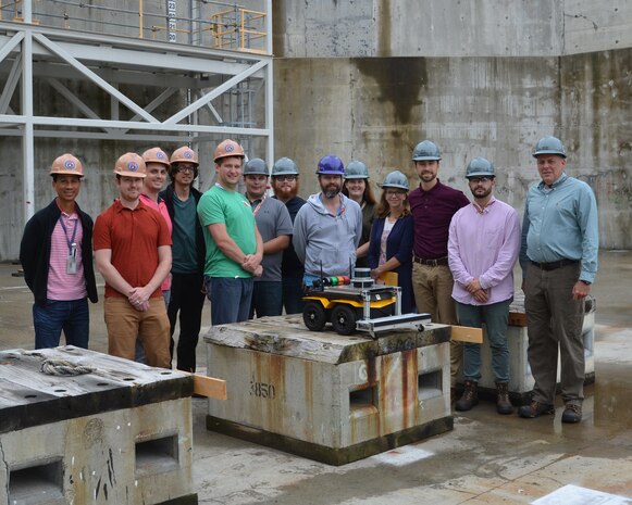 The Autonomous Dry Dock Survey robotics team pose for a group photo after a successful test.