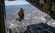 SFC. Cory Christiansen, a member of Special Operations Command Para-Commandos parachute demonstration team jumps out of an HC-130J Combat King II aircraft over Nellis AFB, Nevada, Nov. 15, 2019.  The SOCOM Para-Commandos performed a parachute demonstration for opening ceremonies at Aviation Nation 2019. (U.S. Air Force photo by Airman 1st Class Dwane R. Young)