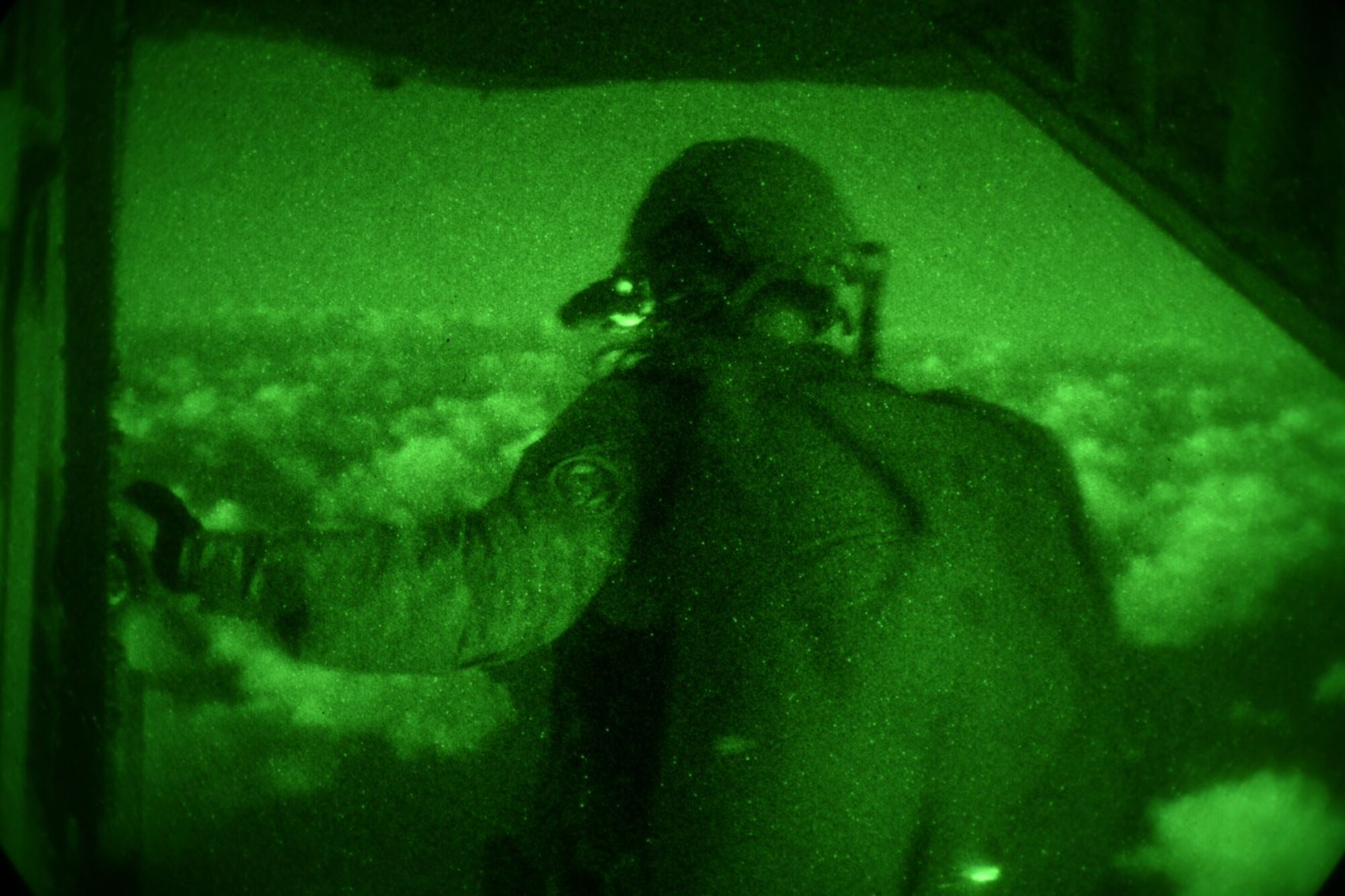 A 320th Special Tactics Squadron jumpmaster overlooks Wake Island, Wake Atoll, during Exercise Gryphon Pacific 20-1, Nov. 15, 2019, over the Pacific Ocean.