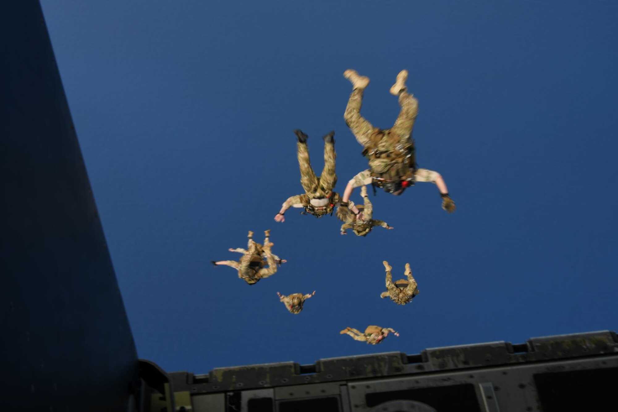 Airmen assigned to the 320th Special Tactics Squadron jump from a 17th Special Operations Squadron MC-130J Commando II during military freefall training at Kwajalein Atoll Nov. 16, 2019.