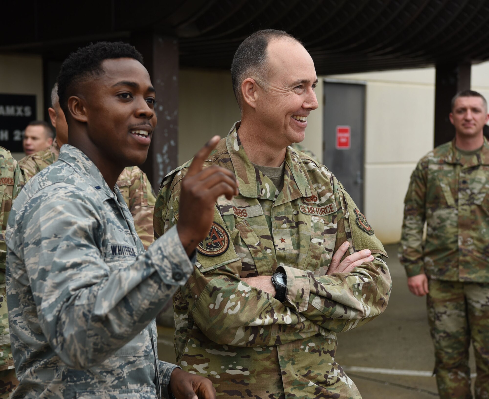 1st Lt. David Whitfield, 605th Aircraft Maintenance Squadron Air Mobility Unit officer in charge, showcases the flight line layout to Brig. Gen. Richard W. Gibbs, Air Mobility Command, Logistics, Engineering and Force Protection director, at Joint Base McGuire-Dix-Lakehurst, N.J., Oct. 31, 2019. Whitfield discussed the plans to replace unserviceable hangars as well as where the new hangar will be located to hold the incoming KC-46 Pegasus. (U.S. Air Force photo by Airman 1st Class Ariel Owings)