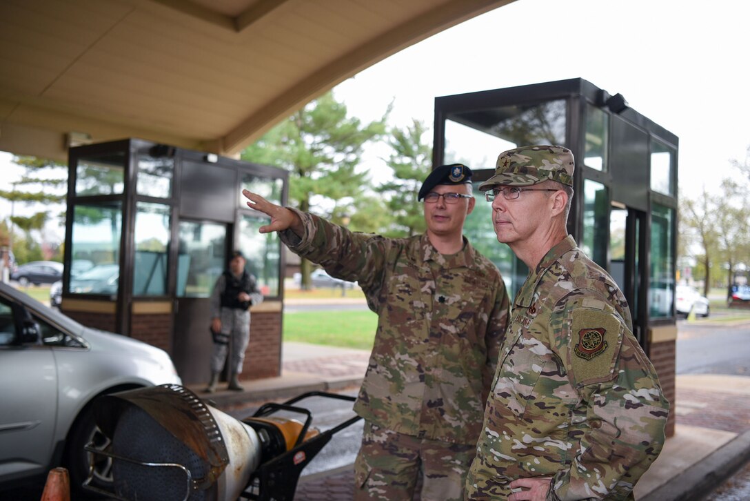 Lt. Col. Patrick Bass, 87th Security Forces Squadron commander, showcases newly installed speed monitors to Brig. Gen. Richard W. Gibbs, Air Mobility Command, Logistics, Engineering and Force Protection director, at Joint Base McGuire-Dix-Lakehurst, N.J., Oct. 31, 2019. Bass and Gibbs discussed the actions taken during and after incidents with the gates, including improvements and implementations that have benefited the installation. (U.S. Air Force photo by Airman 1st Class Ariel Owings)