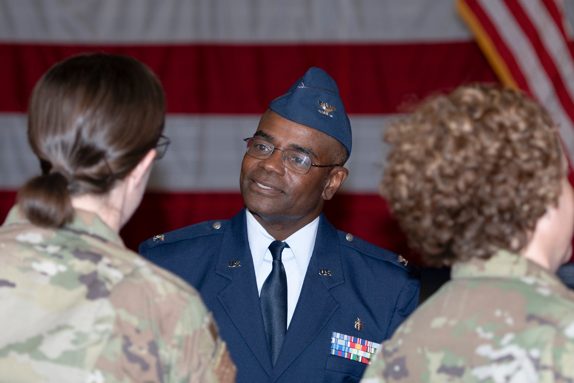 Photo of Col. Dennis Britten greeting well-wishers during change of command ceremony.