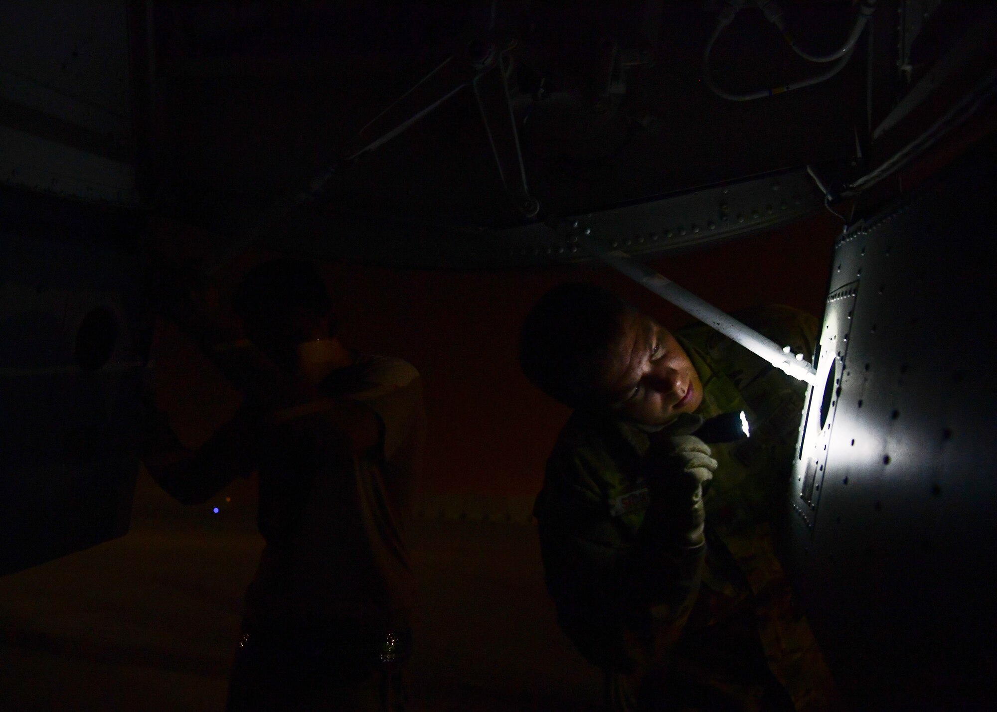 A U.S. Air Force pilot assigned to the 28th Expeditionary Air Refueling Squadron, conducts preflight checks on a KC-135 Stratotanker at Al Udeid Air Base, Qatar, Sept. 28, 2019.