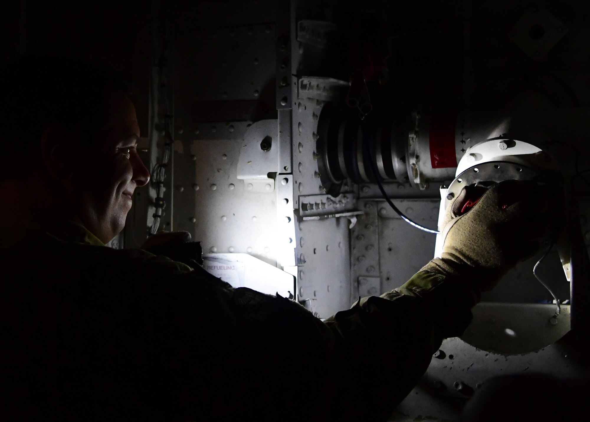 A U.S. Air Force pilot assigned to the 28th Expeditionary Air Refueling Squadron, conducts preflight checks on a KC-135 Stratotanker at Al Udeid Air Base, Qatar, Sept. 28, 2019.