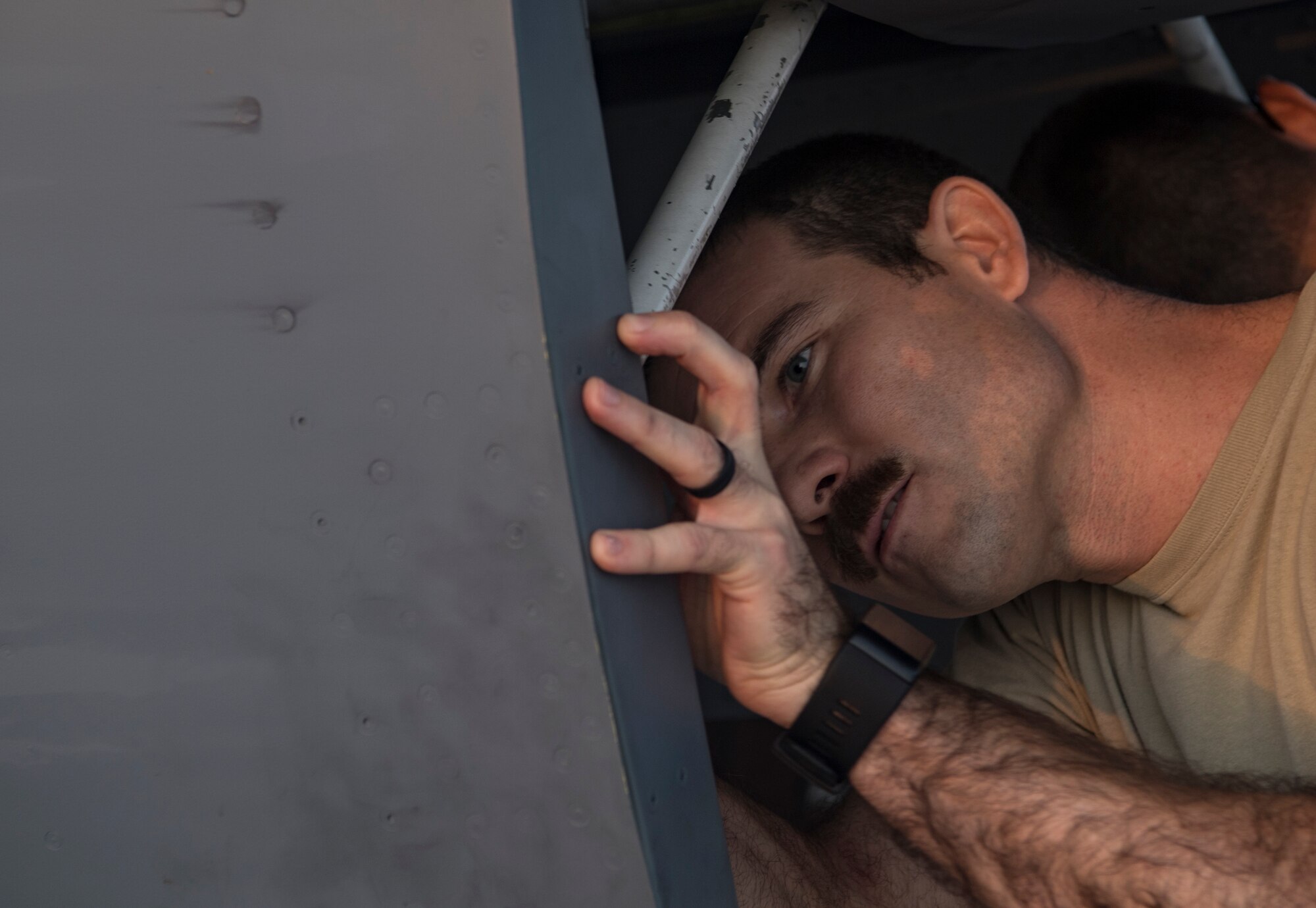 A U.S. Air Force pilot from the 28th Expeditionary Air Refueling Squadron performs a preflight check on a KC-135 Stratotanker at Al Udeid Air Base, Qatar, Oct. 10, 2019.