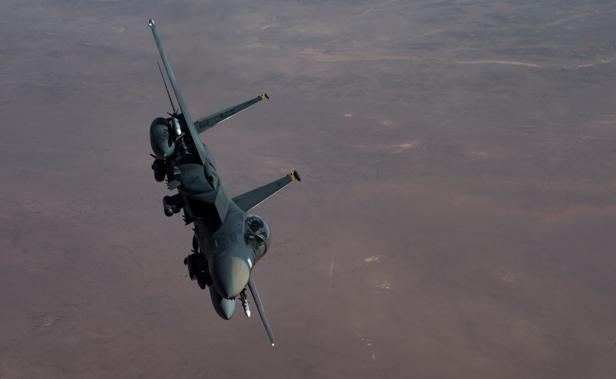 A U.S. Air Force F-15 Strike Eagle rolls out after receiving fuel from a KC-135 Stratotanker assigned to the 28th Expeditionary Air Refueling Squadron, Al Udeid Air Base, Qatar, above an undisclosed location, Oct. 10, 2019.