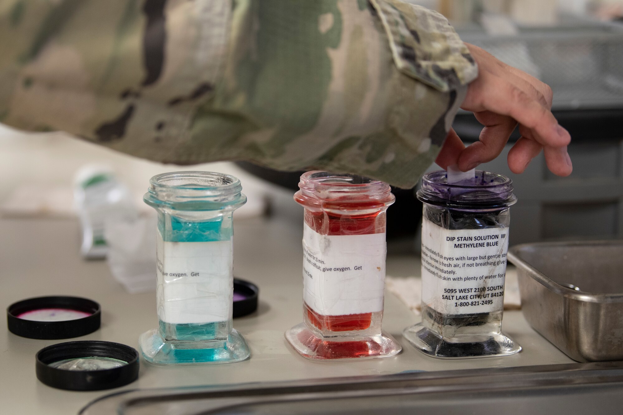 A photo of a Soldier testing a sample for infection.