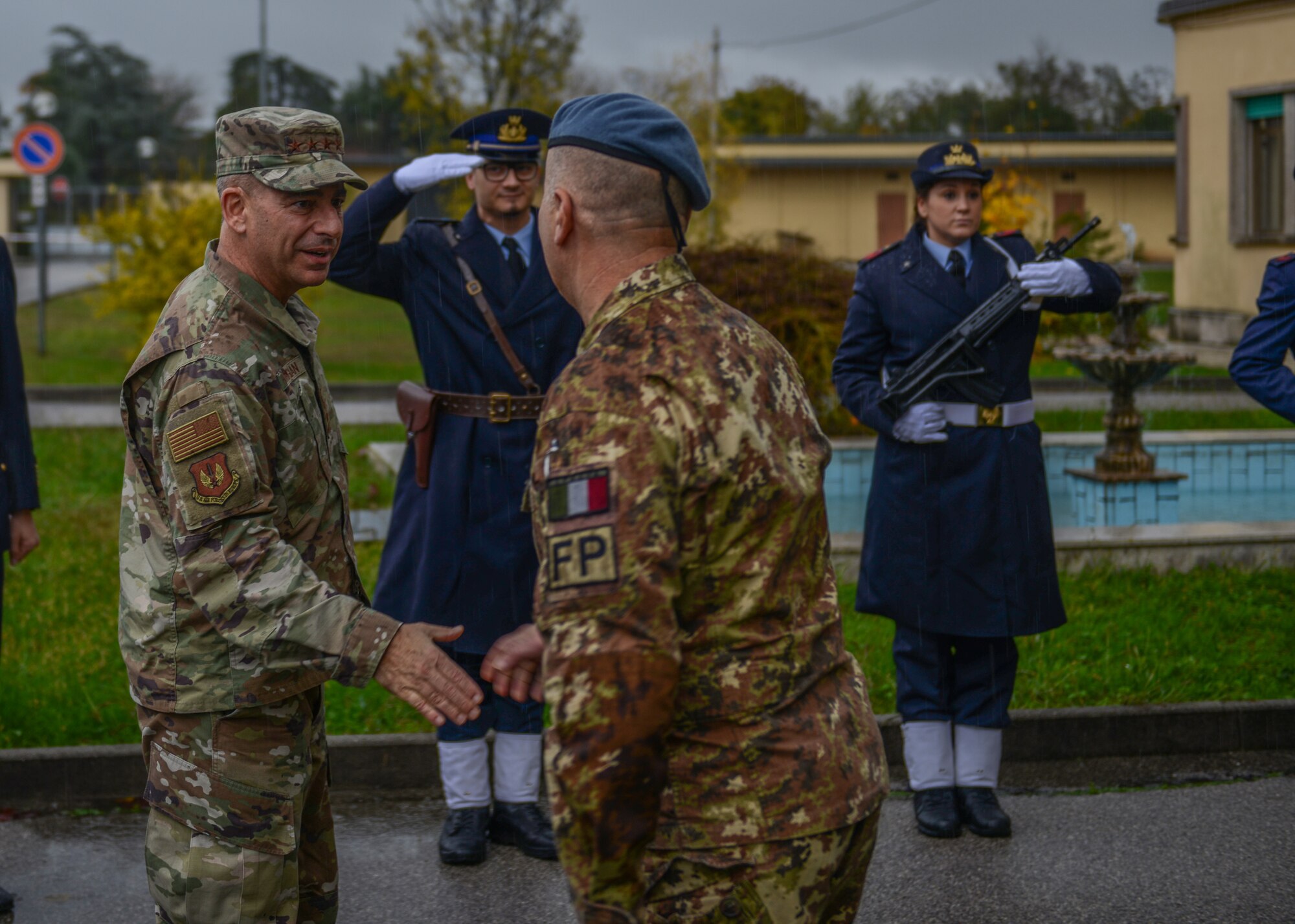 U.S. Air Force Gen. Jeffrey L. Harrigian, U.S. Air Forces in Europe and Air Forces Africa commander, shakes hands with an Italian Air Force member at Aviano Air Base, Italy, Nov. 15, 2019. Gen. Harrigian has served in a variety of flying and staff assignments, including Deputy Director for Strategy, Plans and Assessments, U.S. Forces-Iraq, in support of Operation Iraqi Freedom and as Chief of the Joint Exercise Division at NATO's Joint Warfare Center, Stavanger, Norway. (U.S. Air Force photo by Airman Thomas S. Keisler IV)