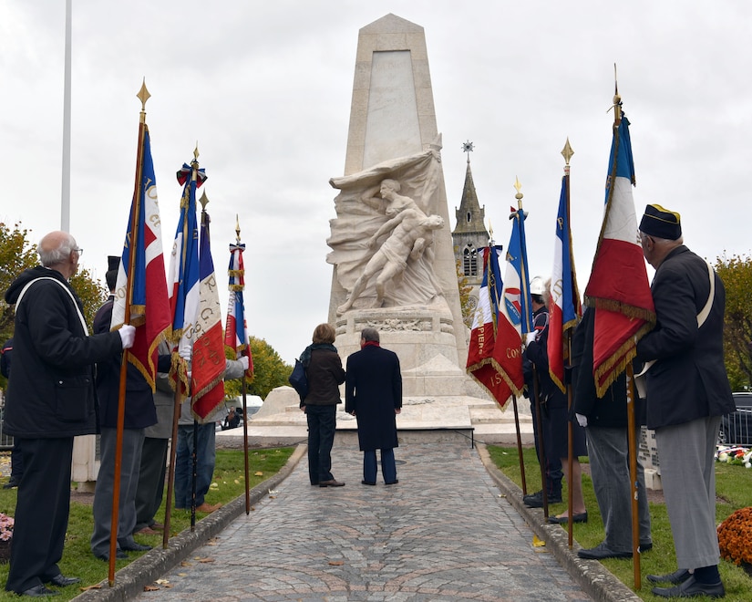 Issoudun mayor André Laignel (center) stands before a newly reconditioned war memorial alongside the memorial creator Ernest Nivet's daughter during an Armistice Day commemoration Nov. 11, 2019, in Issoudun, France. Airmen from the 32nd Aerial Refueling Squadron at Joint Base McGuire-Dix-Lakehurst, New Jersey, attended the ceremony to help commemorate the day and honor fallen Airmen who were stationed at the 3rd Aviation Instruction Center during World War I. (U.S. Air Force photo by Tech. Sgt. Chris Powell)
