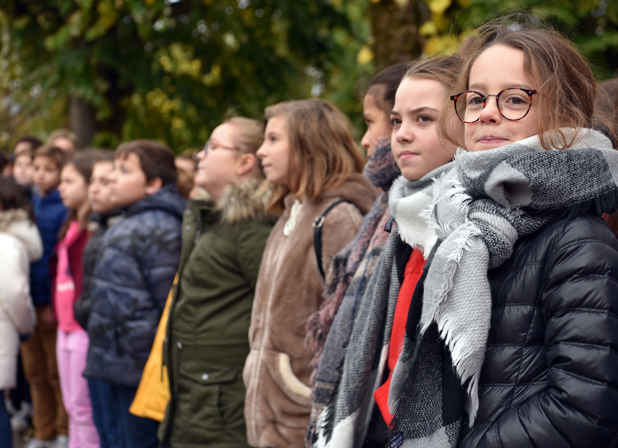 Local school children look on during an Armistice Day commemoration Nov. 11, 2019, in Issoudun, France. Armistice Day is commemorated annually to mark the armistice signed between the Allies and Germany for the end of hostilities during World War I. (U.S. Air Force photo by Tech. Sgt. Chris Powell)