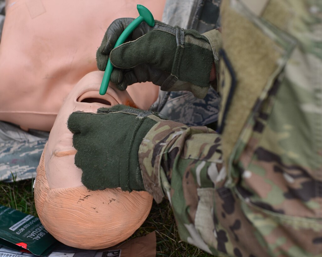 U.S. Army Capt. Ernesto Gonzalez, 212th Combat Support Hospital nurse, prepares to insert a nasopharyngeal airway tube into a simulated casualty during a joint medical training event at Ramstein Air Base, Germany, Nov. 15, 2019. The training event brought together medical personnel from the 86th Aeromedical Evacuation Squadron, 86th Aerospace Medicine Squadron and the 212th CSH to improve on joint operations between Air Force and Army personnel. (U.S. Air Force photo by Staff Sgt. Jimmie D. Pike)