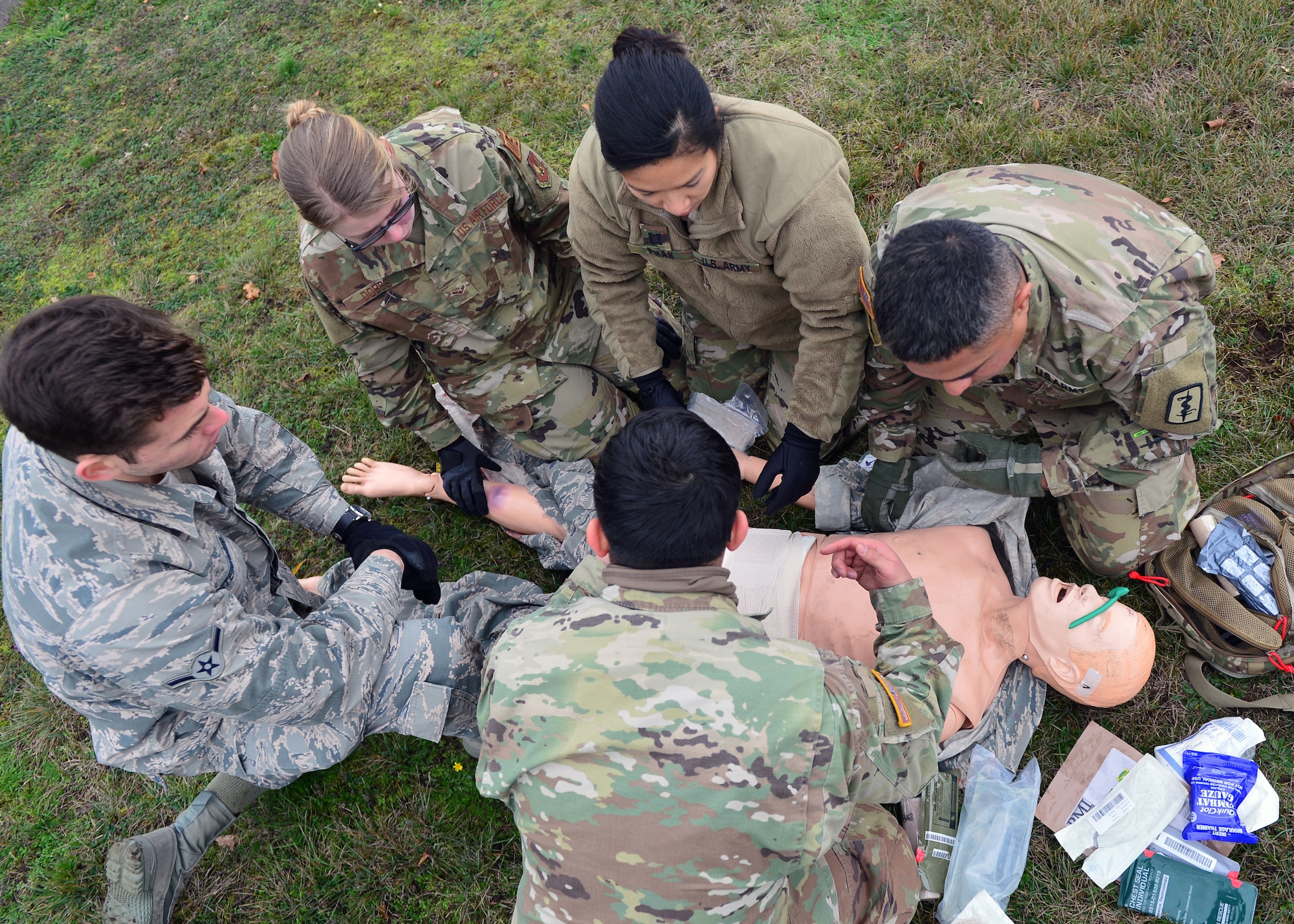 U.S. Airmen and Soldiers assigned throughout the Kaiserslautern Military Community provide medical care to a simulated casualty during a joint medical training event at Ramstein Air Base, Germany, Nov. 15, 2019. The training event builds partnerships between sister services to improve response procedures in real-world scenarios. (U.S. Air Force photo by Staff Sgt. Jimmie D. Pike)