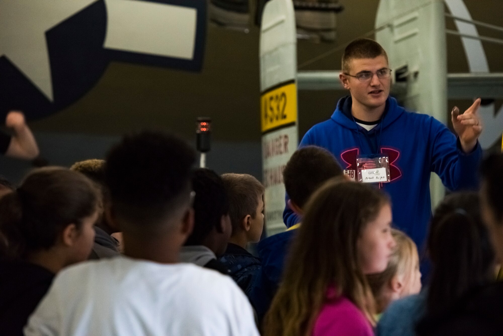 Staff Sgt. Marcell Ruijne, 436th Civil Engineer Squadron construction inspector, speaks in front of a group of children at the Air Mobility Command Museum Nov. 18, 2019, at Dover Air Force Base, Del. Students from local schools visited the museum’s 12th annual Geographic Information Systems Day, a day where approximately 250 children learned about information systems and sciences. (U.S. Air Force photo by Airman 1st Class Jonathan Harding)