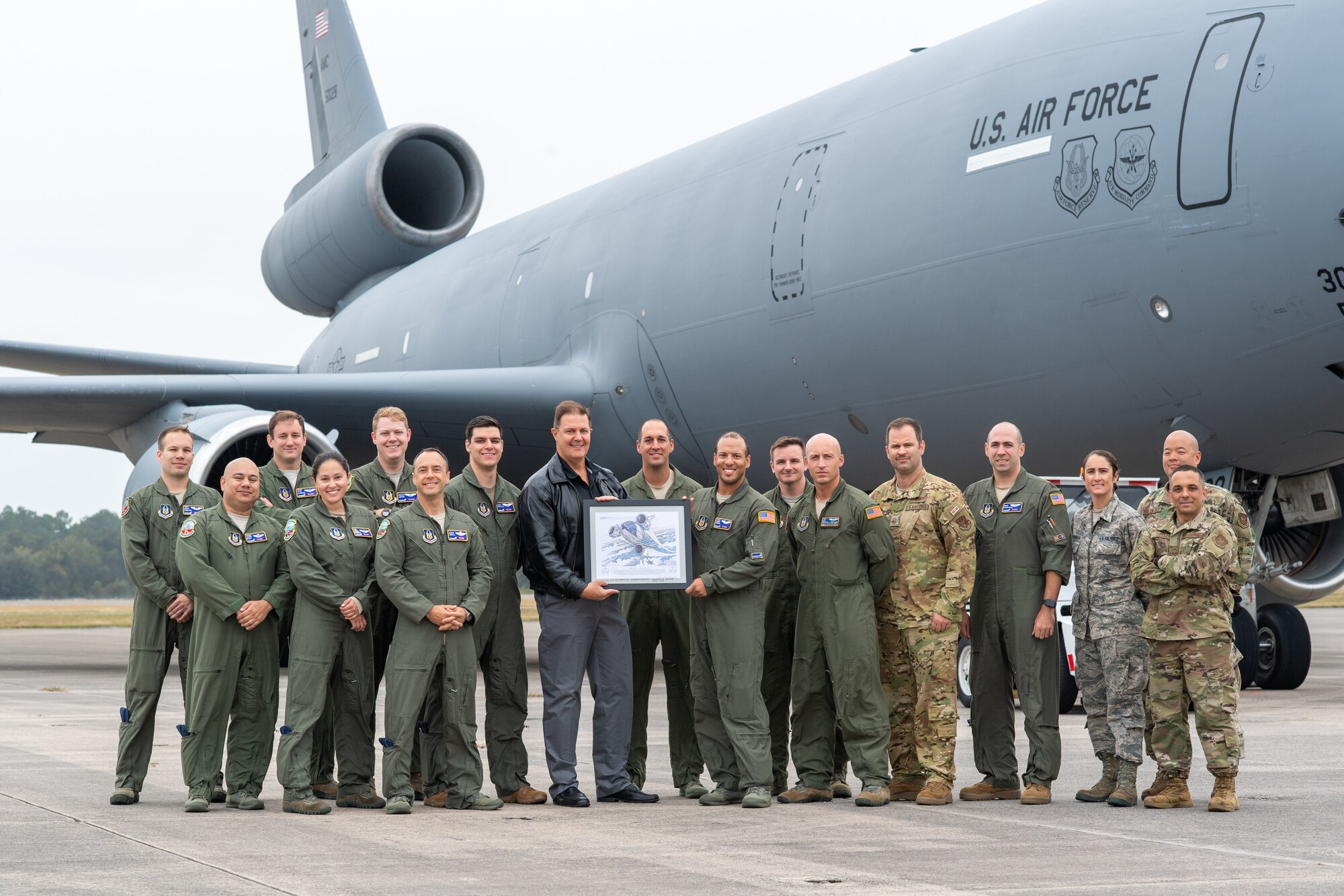 Scott Morrison, gov't liason with Jaxsonville Jetport, and U.S. Air Force members with the 78th ARS and 714th Aircraft Maintenance Squadron, 514th Air Mobility Wing, Joint Base McGuire-Dix-Lakehurst, N.J., pose in front of a KC-10 Extender at Naval Air Station Cecil Field, Fla., Nov. 14, 2019, during Checkered Flag. Checkered Flag is a large-scale aerial exercise designed to integrate various aircraft to enhance the mobility, deployment, and employment capabilities of U.S. Air Force members. (U.S. Air Force photo by Tech. Sgt. Michael K. Hong)