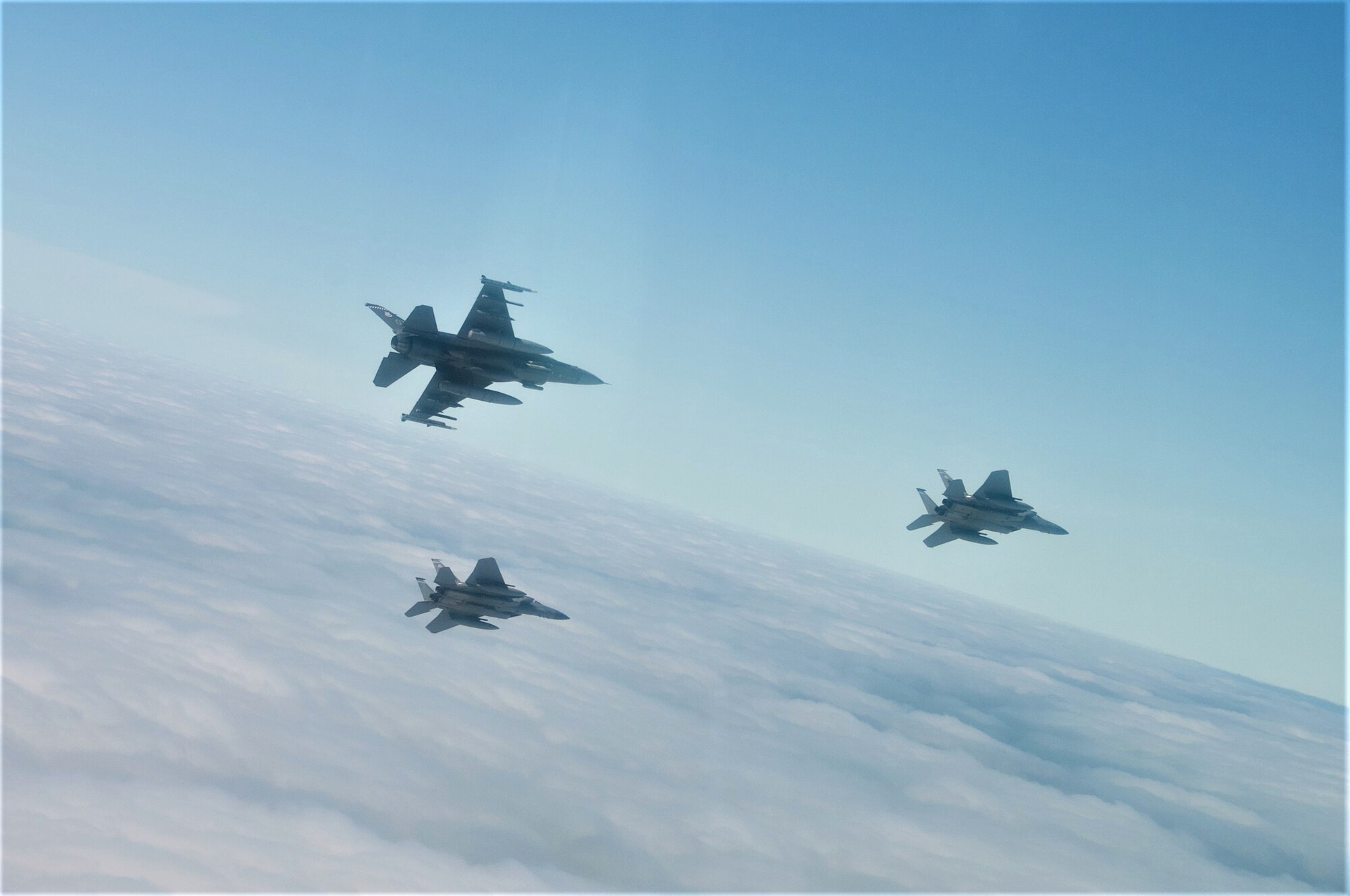 U.S. Air Force F-15C Pilots, Capt. Aaron Eshkenazi and Maj. Jonah Brown, and F-16 Pilot Lt. Col. Matthew Russell, from the 85th Test and Evaluation Squadron, Eglin AFB, Fla. prepare to fly over the Miami Dolphins' stadium on November 17, 2019