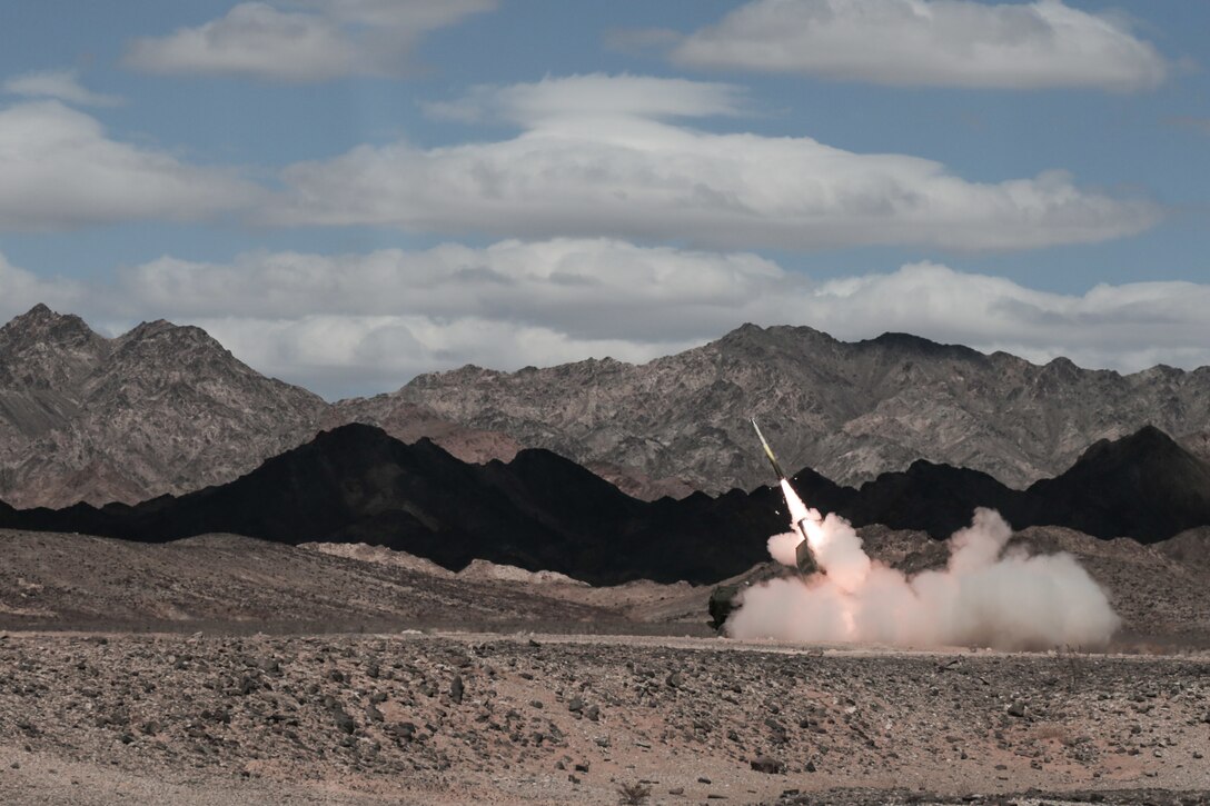 U.S. Marines with 5th Battalion, 11th Marine Regiment, 1st Marine Division, practice launching rockets from a high mobility artillery rockets system in a specified training area as part of Assault Support Tactics 2 during the Weapons and Tactics Instructor Course 1-19 at Landing Zone Star Assault, Chocolate Mountain Aerial Gunnery Range, Calif., Oct. 3, 2018. WTI is a seven-week training event hosted by Marine Aviation Weapons and Tactics Squadron 1, which emphasizes operational integration of the six functions of Marine Corps aviation in support of a Marine air-ground task force. The course also provides standardized advance tactical training and certification of unit instructor qualifications to support Marine aviation training and readiness, and assists in developing and employing aviation weapons and tactics. (U.S. Marine Corps photo by Sgt. Jeremy Laboy)