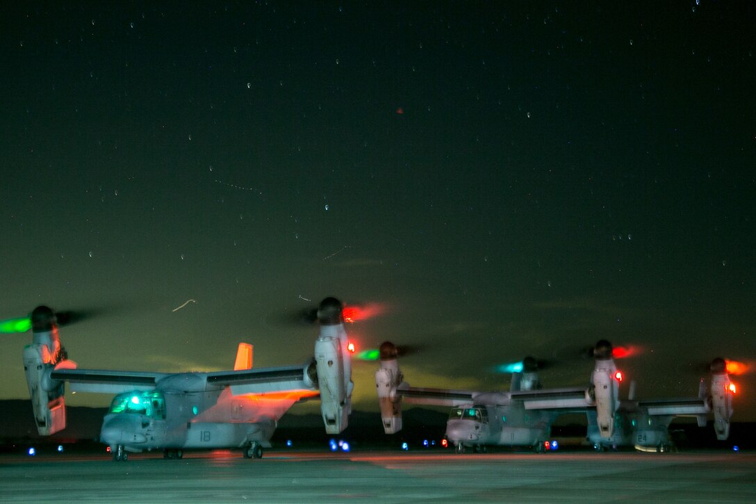 U.S. Marines with Weapons and Tactics Instructors Course 1-19, use MV-22B Ospreys for combat assault transport of Marines and equipment during Assault Support Tactics 4, at Strategic Expeditionary Landing Field, Marine Corps Air-Ground Combat Center Twentynine Palms, Calif., Oct. 9, 2018. WTI, a seven week training event hosted by Marine Aviation Weapons and Tactics Squadron 1, emphasizes operational integration of the six functions of Marine Corps aviation in support of a Marine air-ground task force. This year, Marines and Sailors with the Special Purpose Marine Air-Ground Task Force Crisis Response-Central Command 19.1 served as the command element for WTI. (U.S. Marine Corps photo by Cpl. Zachary Catron)