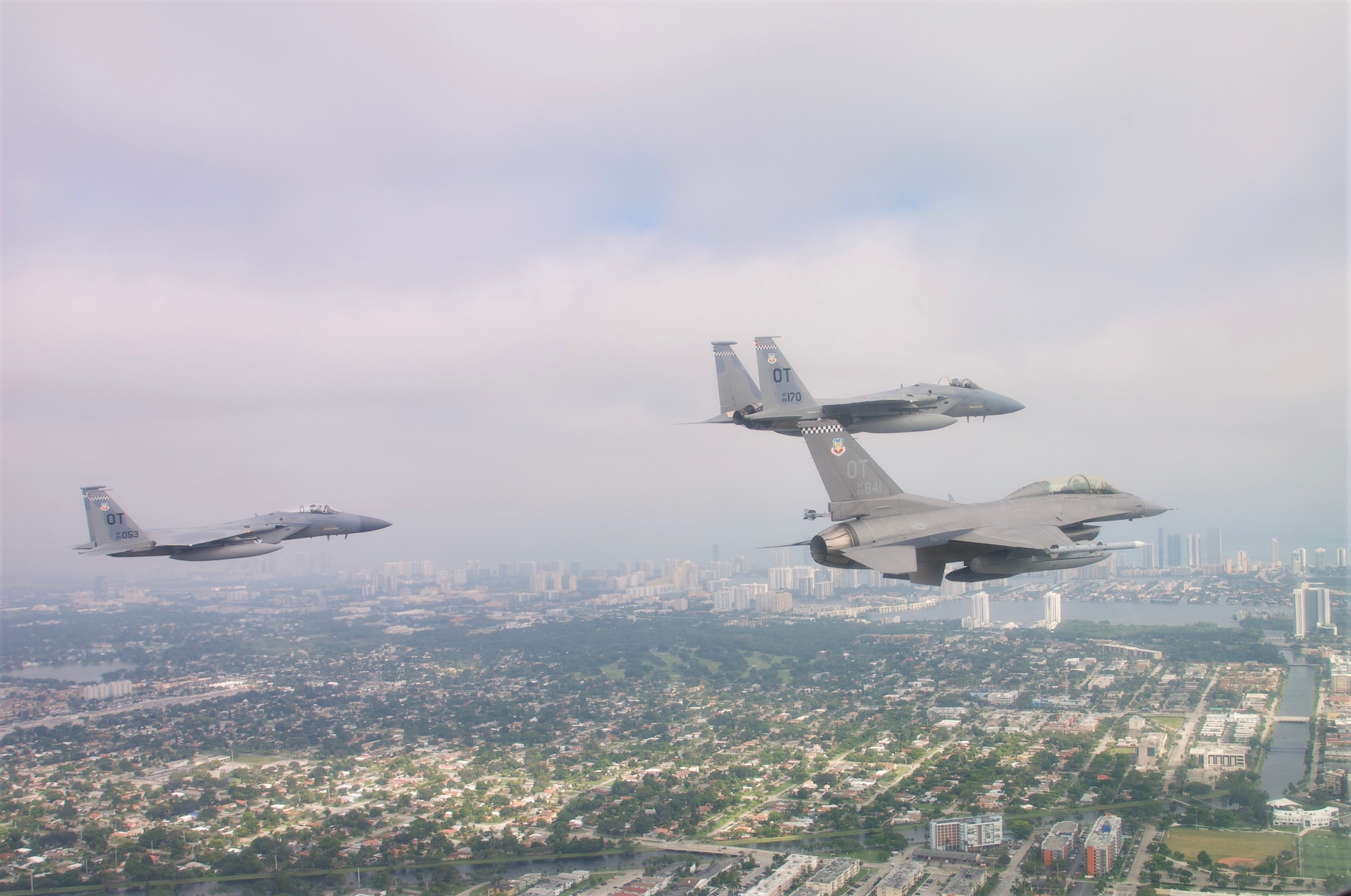U.S. Air Force F-15C Pilots, Capt. Aaron Eshkenazi and Maj. Jonah Brown, and F-16 Pilot, Lt. Col. Matthew Russell, from the 85th Test and Evaluation Squadron, Eglin AFB, Fla. prepare to flyover the Miami Dolphins' stadium on November 17, 2019.