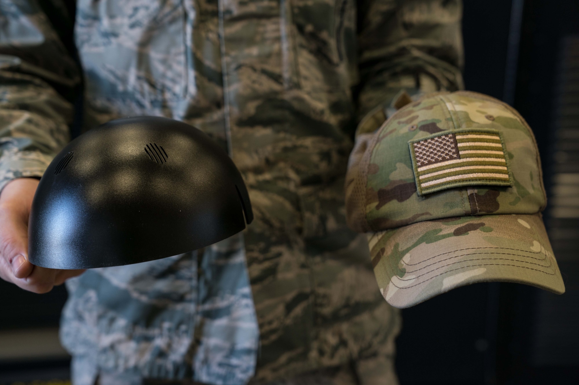 Tech. Sgt. Haisen Exon, 90th Missile Maintenance Squadron, Facilities Maintenance Section, support section NCOIC, shows the bump cap insert and how it inserts into a normal cap on F.E. Warren AFB, Wyoming, Nov. 18, 2019. He teams up with the 90th Missile Wing LaunchWerx agency to bring forward an idea to prevent future head injuries across the wing. (U.S. Air Force photo by Joseph Coslett)
