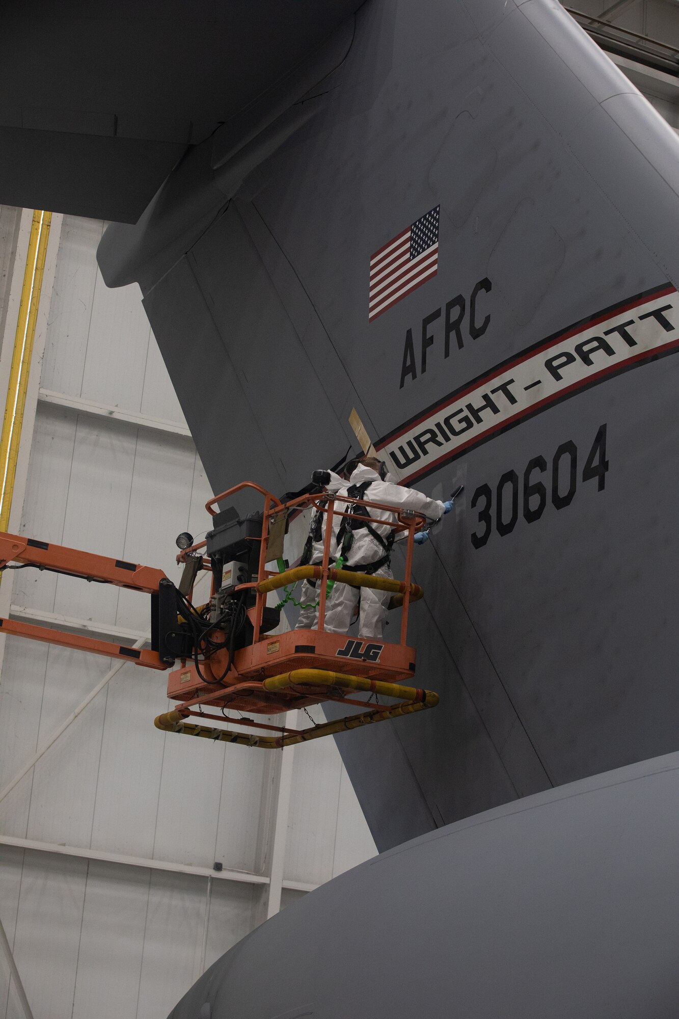 Staff Sgt. Charles Swaim and Senior Airman Clayton Langston, both aircraft structural maintenance technicians with the 445th Maintenance Squadron, spot paint a C-17 Globemaster III during the Oct. 6, 2019 unit training assembly.